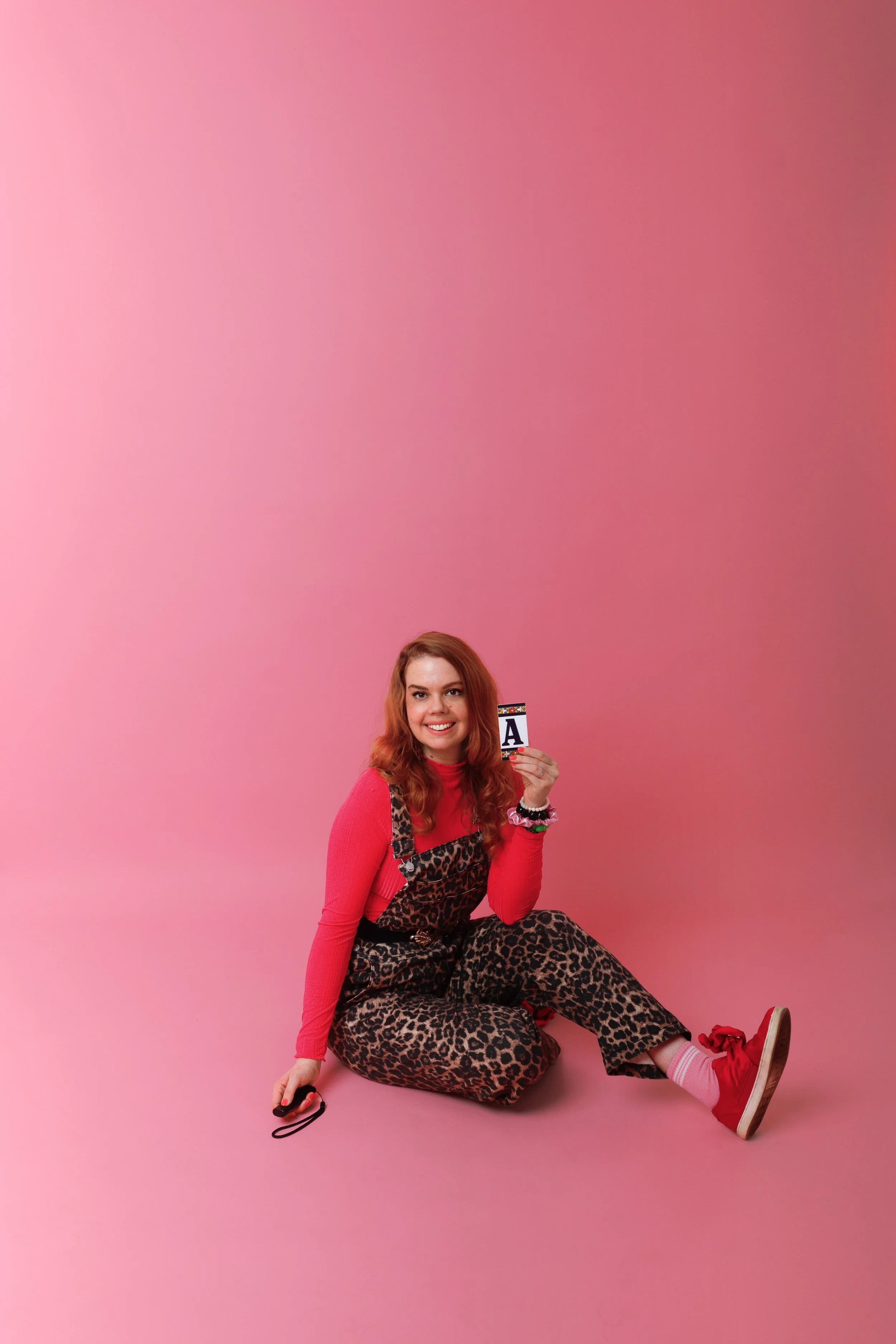 women sitting in the floor and smiling