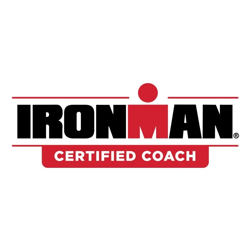 Ironman Certified Coach logo featuring the Ironman name with a stylized figure and a red banner that says "Certified Coach"