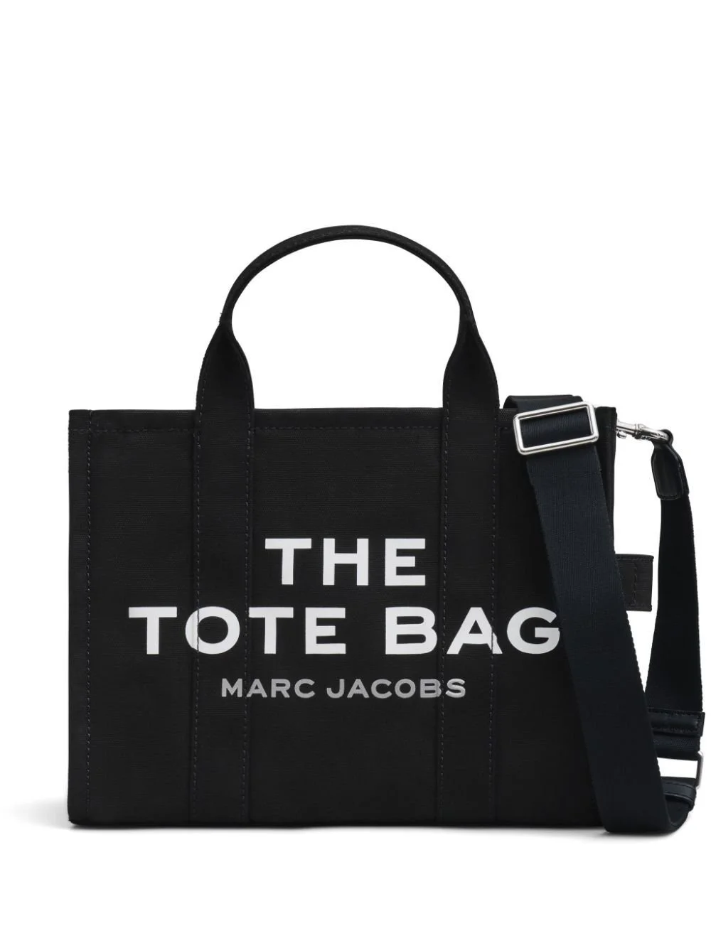 Black tote bag with white text that reads "The Tote Bag Marc Jacobs" and an adjustable shoulder strap.