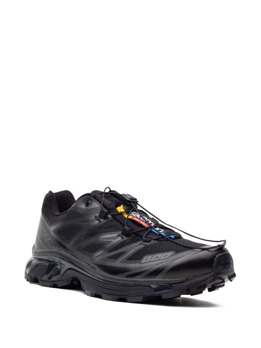 Black athletic running shoe with a rugged sole, brand logo, and lace lock system, designed for trail running.
