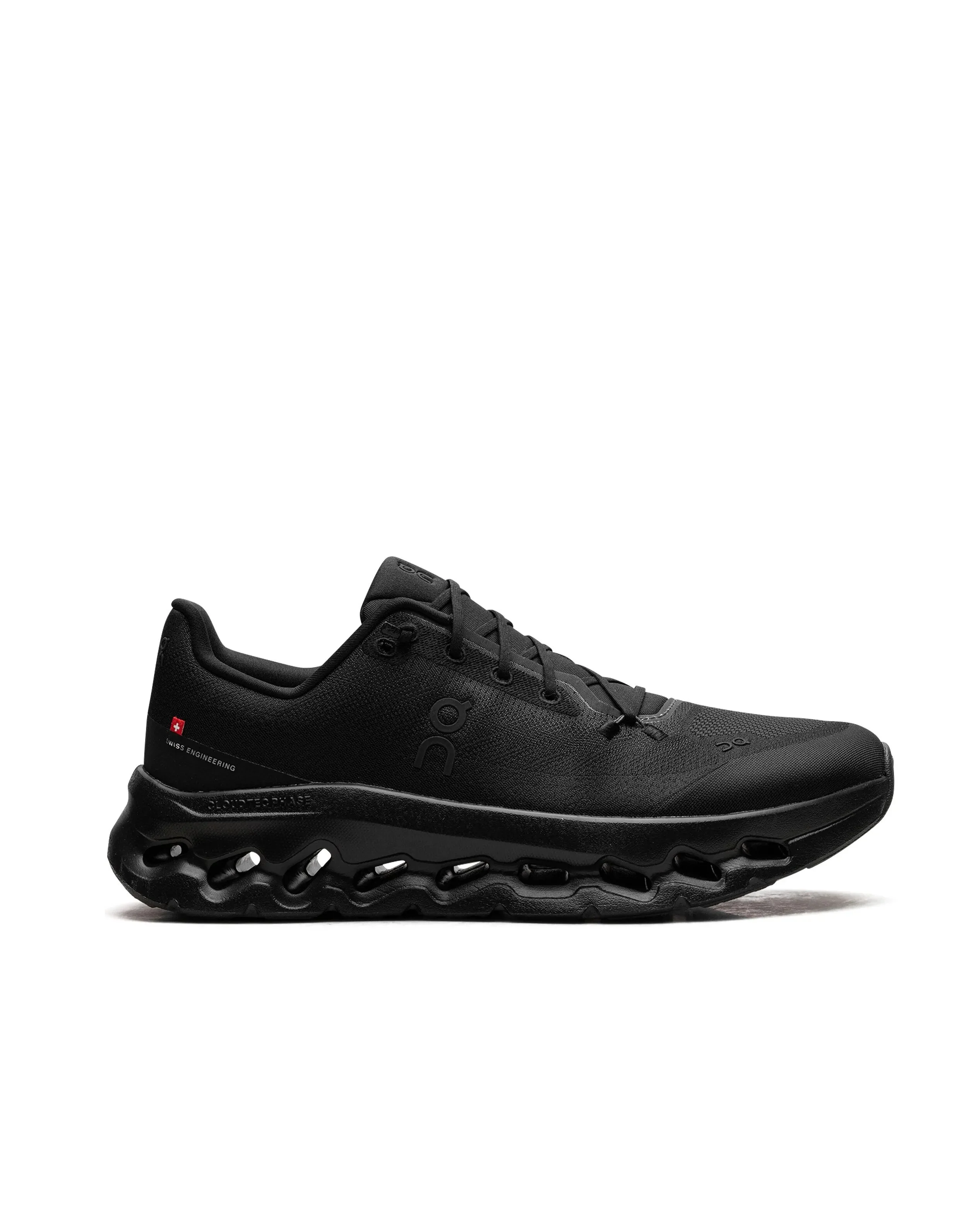 A black athletic shoe with a textured upper, logo on the side, and a cushioned sole with air pockets.
