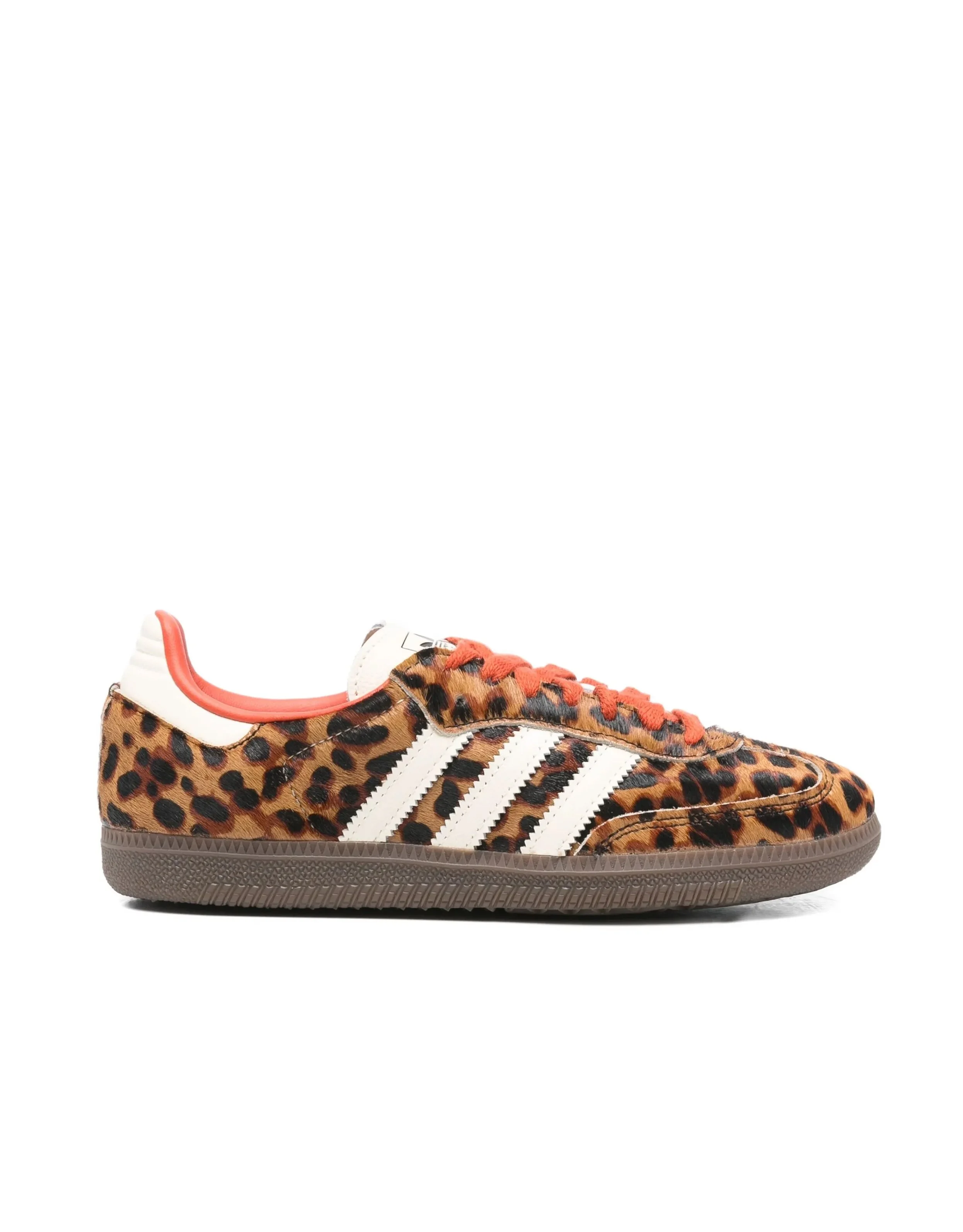 Leopard print Adidas sneakers with white stripes and orange laces.