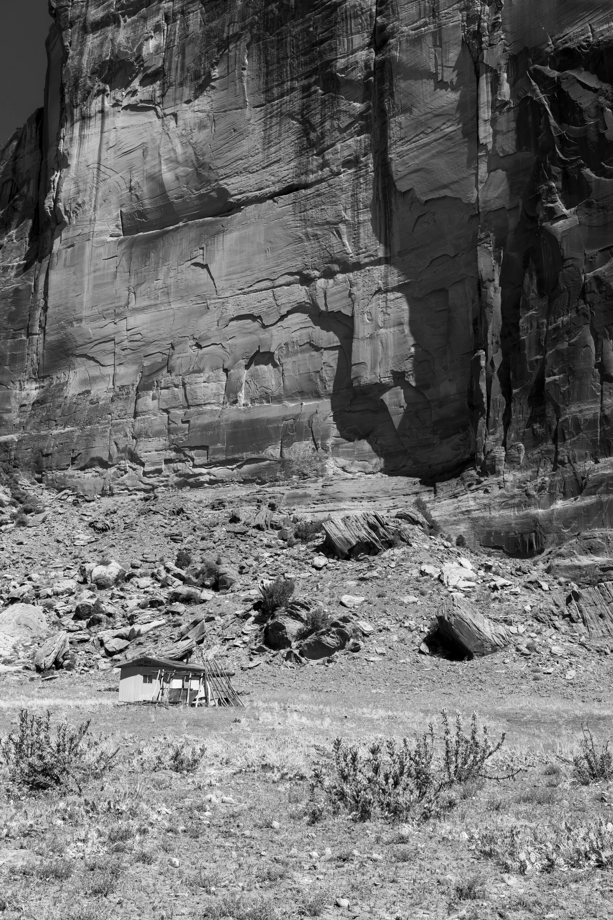 Small house and cliff face