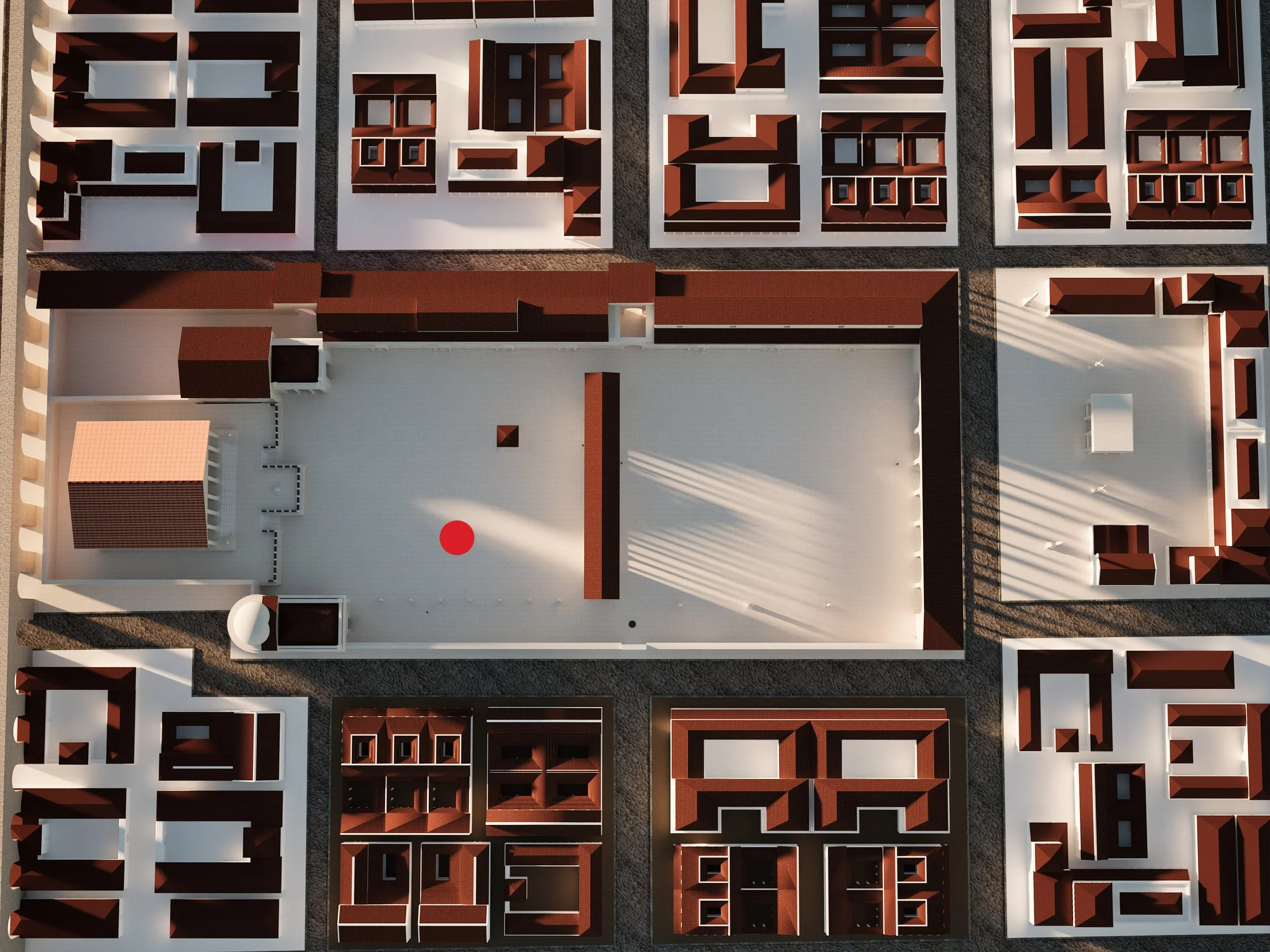 Aerial view of architectural scale model with a central square, surrounded by brown-roofed buildings and streets forming a grid layout.