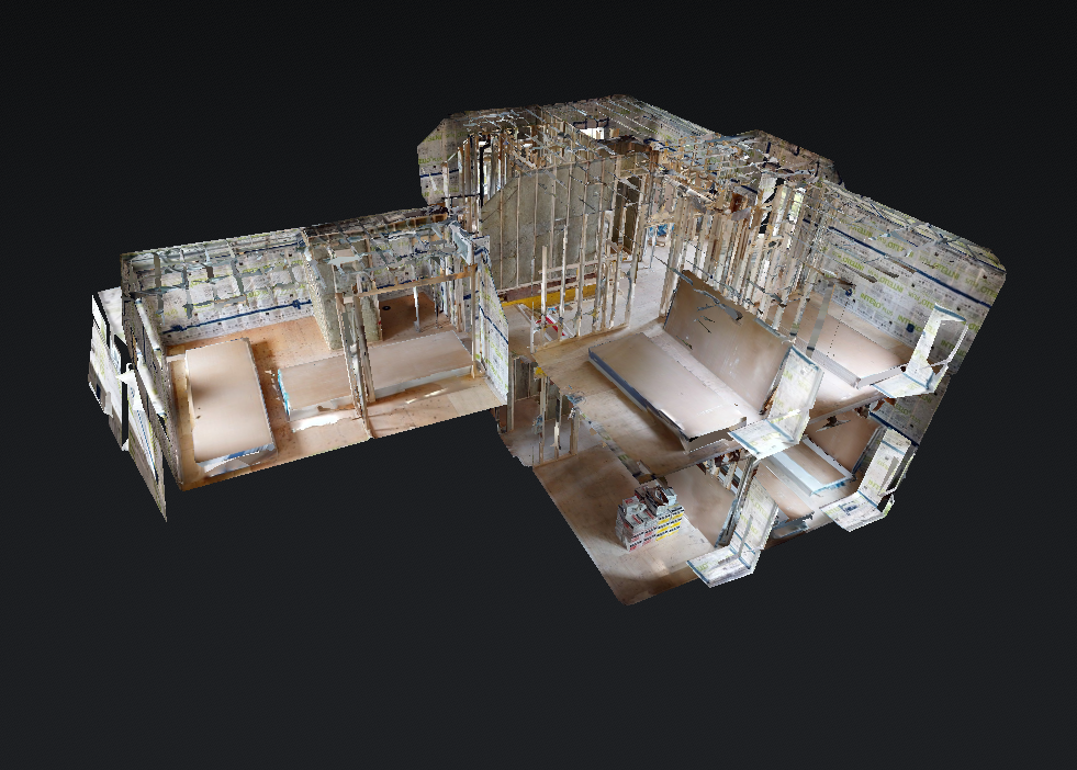 3D model of house interior under construction with visible framing and partial wall installations.