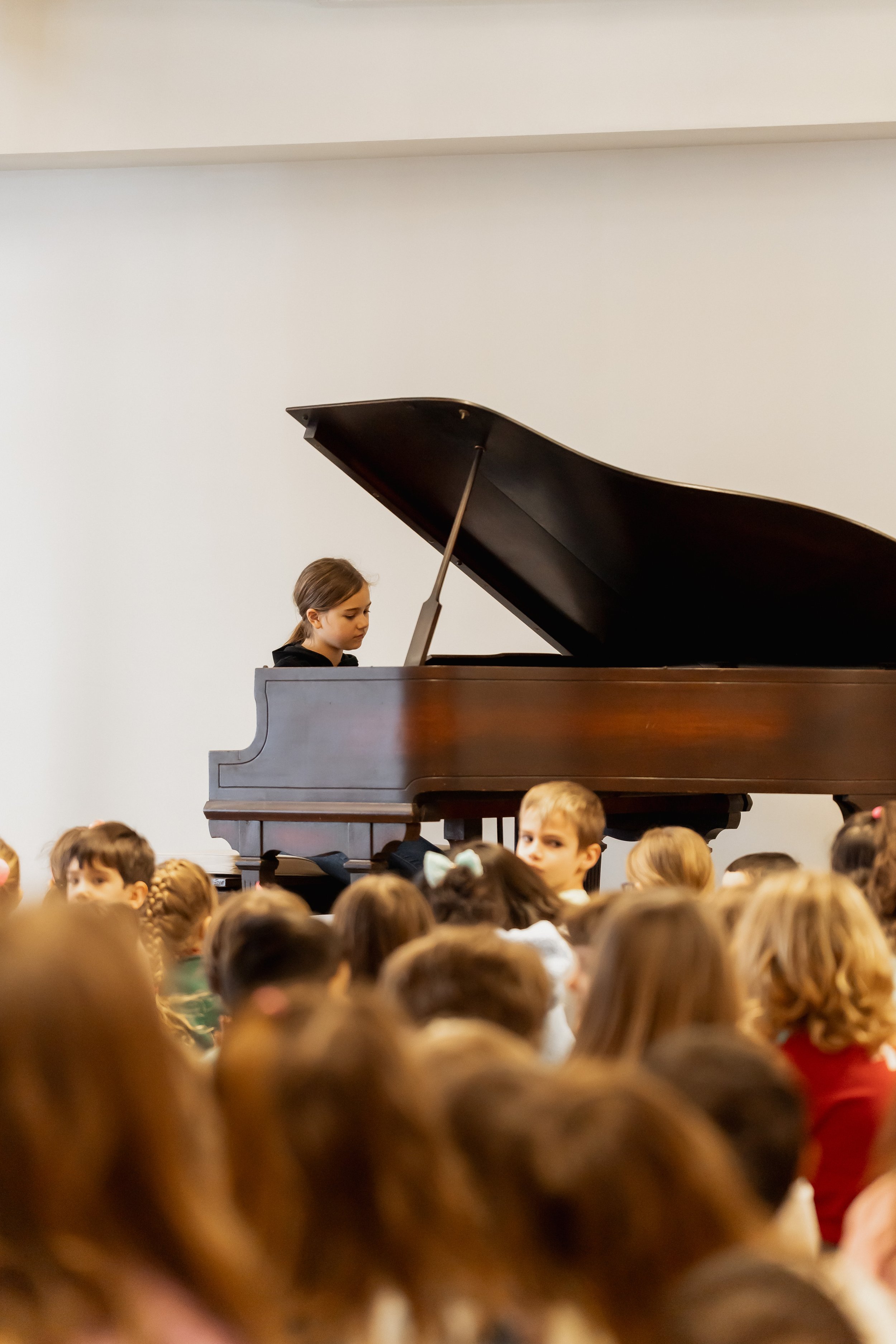Student playing piano.