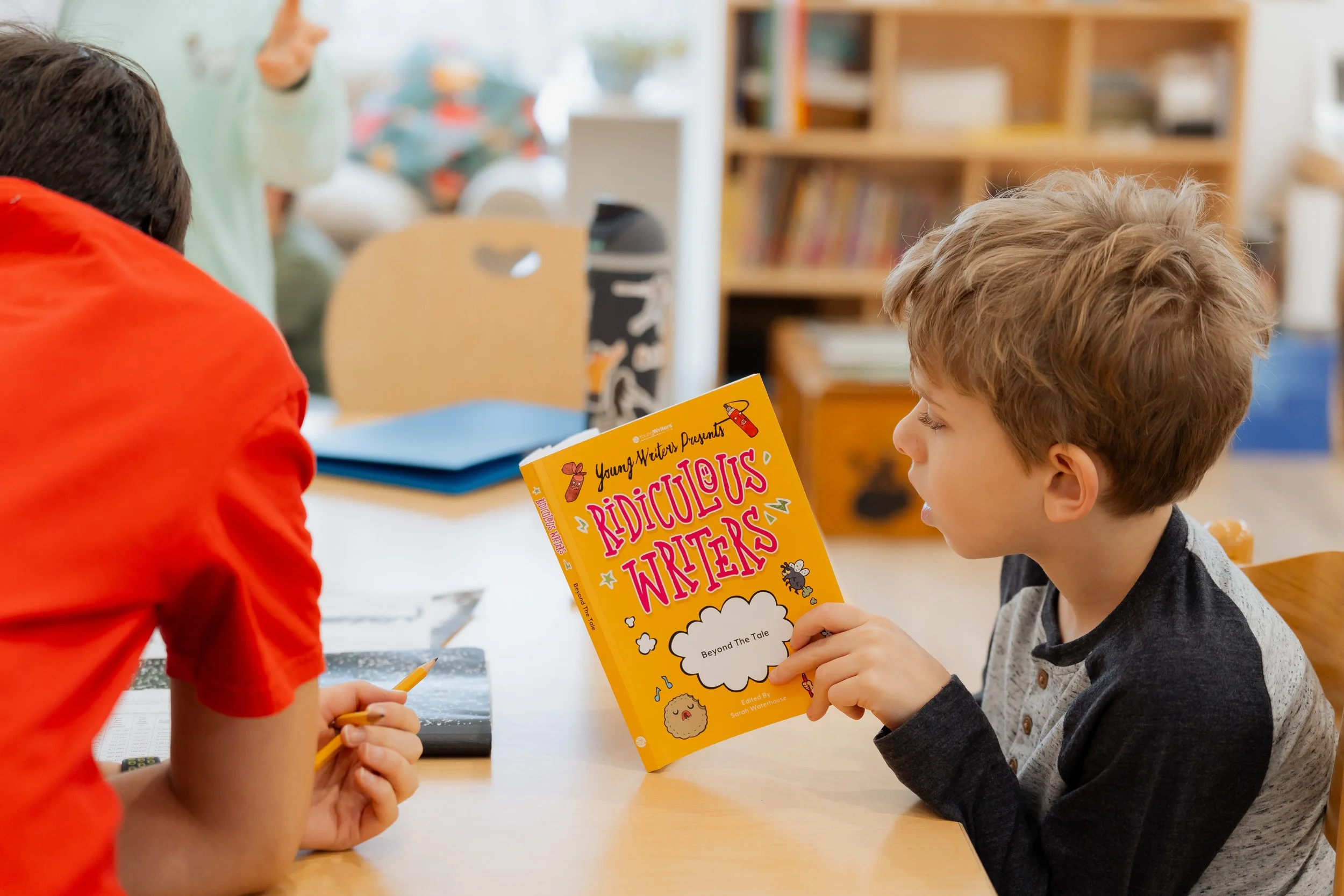Elementary student reading a book.