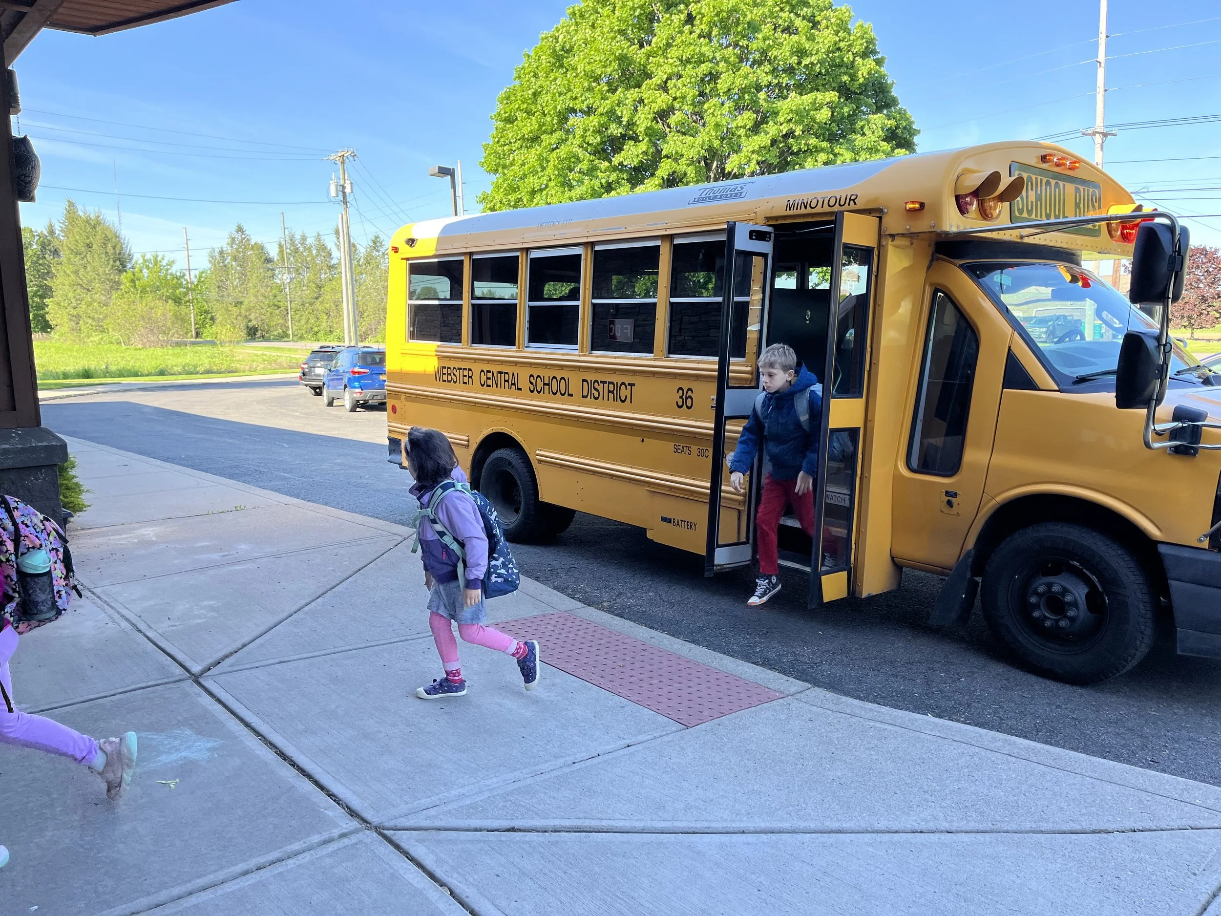 Students walking off the bus.