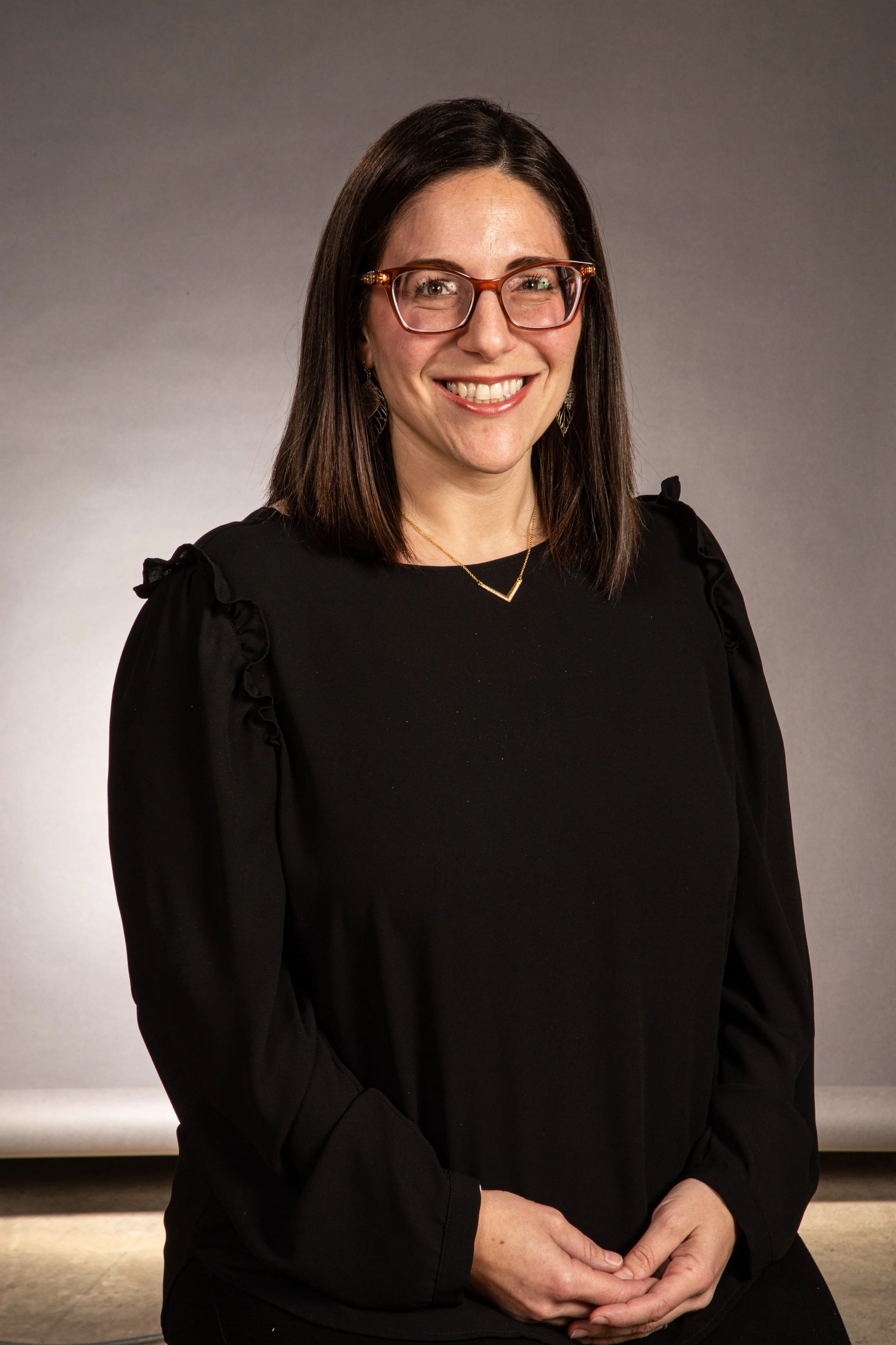 Portrait of Pina LaDelfa, Board Finance Chair at Webster Montessori School, smiling.