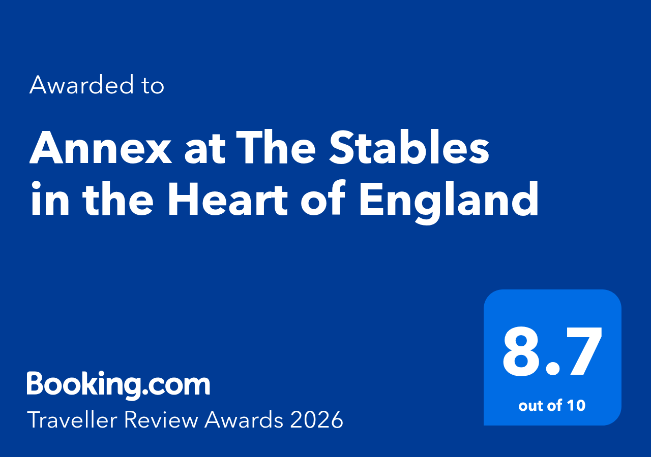 Award certificate from Booking.com for Annex at The Stables in the Heart of England, with a rating of 8.7 out of 10, from the 2026 Traveller Review Awards.
