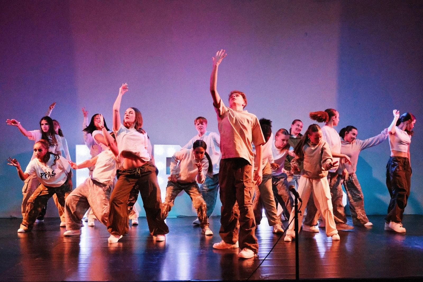 PPAS Lambeth students performing on stage at a showcase after training in dance and performing arts
