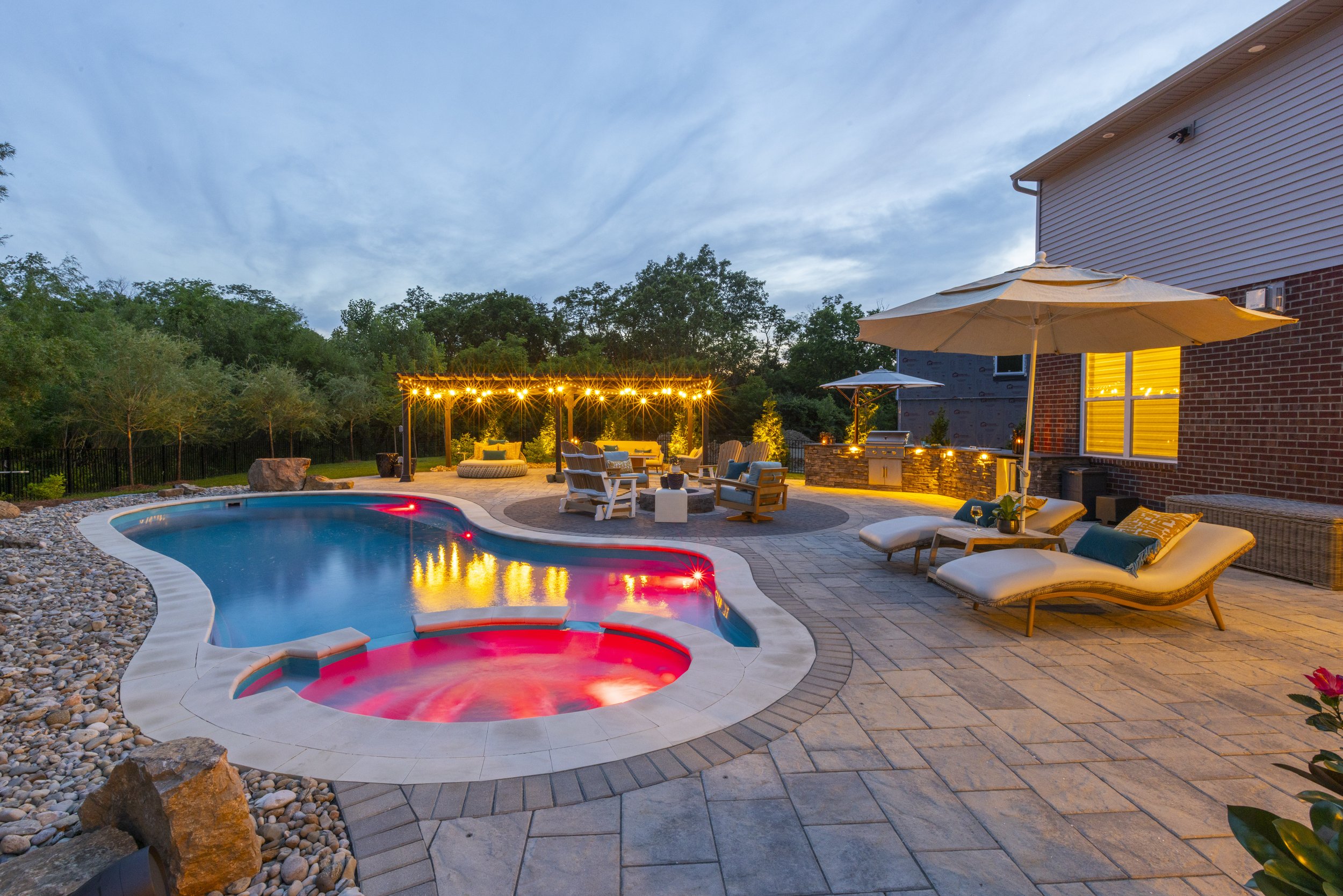 After photo of a fully renovated outdoor living space in Cincinnati, Ohio, featuring new hardscape and furniture.