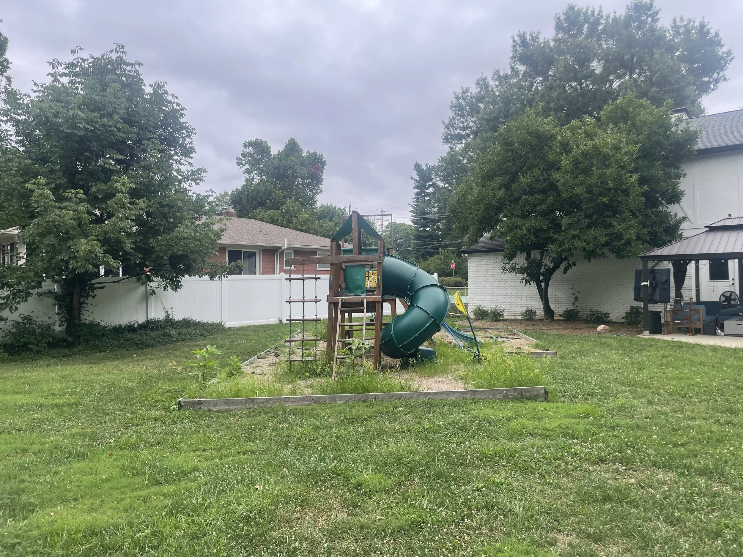 Before image of a backyard outdoor living space before its transformation in Cincinnati, Ohio.