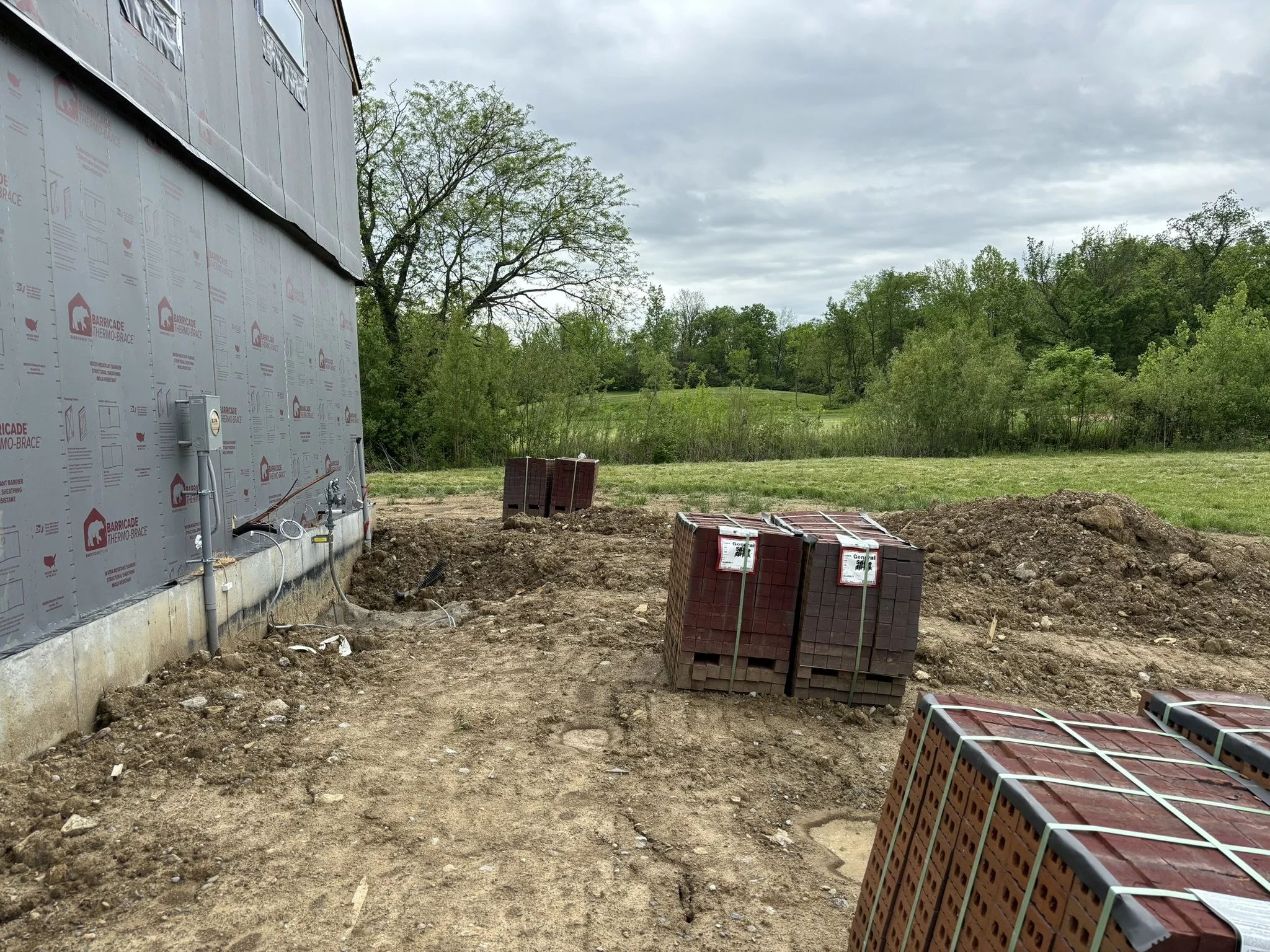 Before photo of an unfinished outdoor living space prior to design and installation in Cincinnati, Ohio.