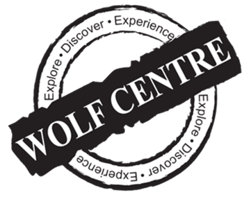 Logo for Wolf Centre featuring a black diagonal banner with 'WOLF CENTRE' in white text overlaying a circular design with the words 'Explore. Discover. Experience. Expliquer.'