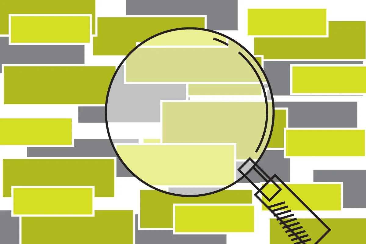 Spreadsheet cells with a magnifying glass over them