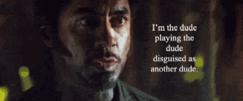 Close-up of a man's face at night with a serious expression, with white text overlay saying 'I'm the dude playing the dude disguised as another dude.'