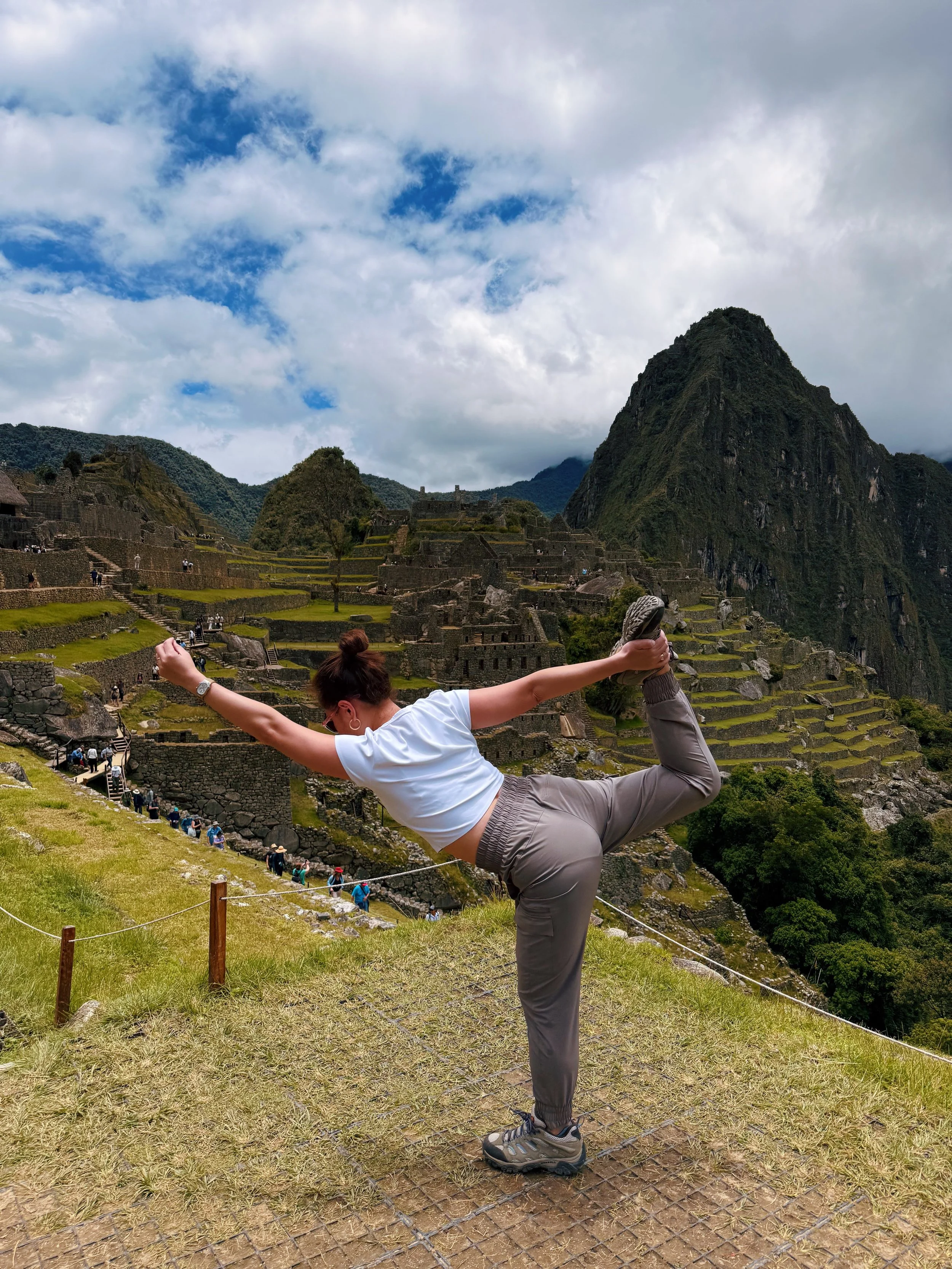 Elsewhere Retreats guest hits a yoga pose during her included excursion to Machu Picchu