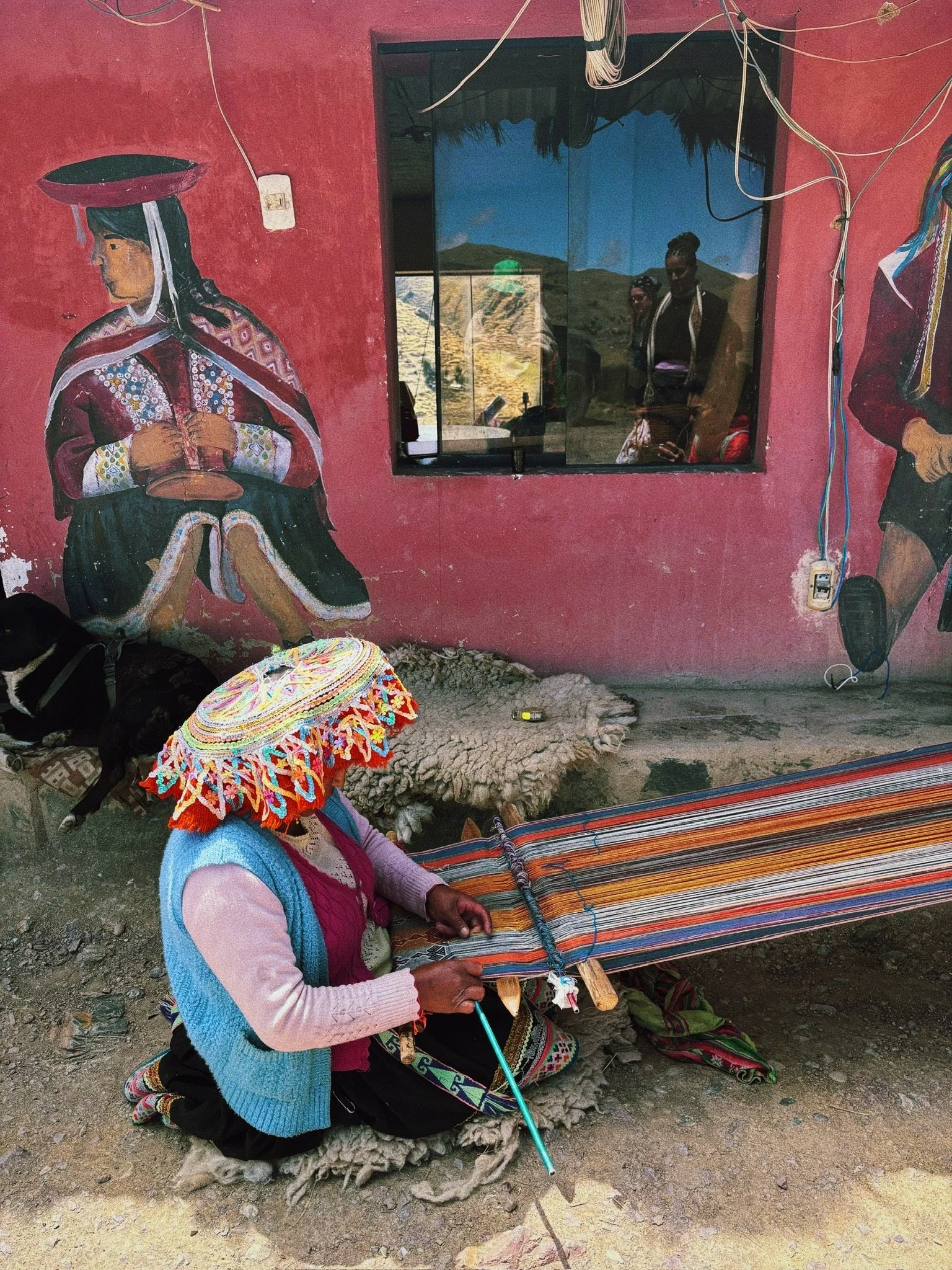 Traditional Andean weaver using the backstrap loom method in the Sacred Valley of Peru
