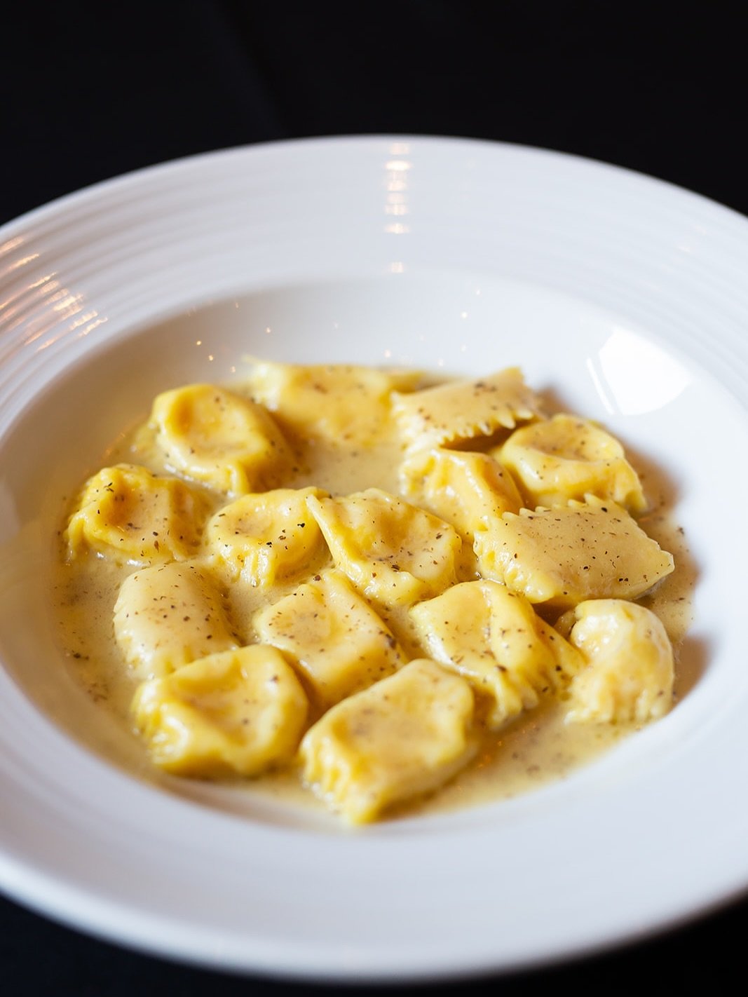 𝐂𝐨𝐫𝐧 𝐀𝐠𝐧𝐨𝐥𝐨𝐭𝐭𝐢 🌽
House-made corn ravioli, finished in a silky truffle butter sauce &mdash; handcrafted by Chef Patrizio🍝✨

A dish that celebrates summer, technique, and flavor.

Join us for dinner &mdash; Tuesday to Sunday from 4:30 PM
