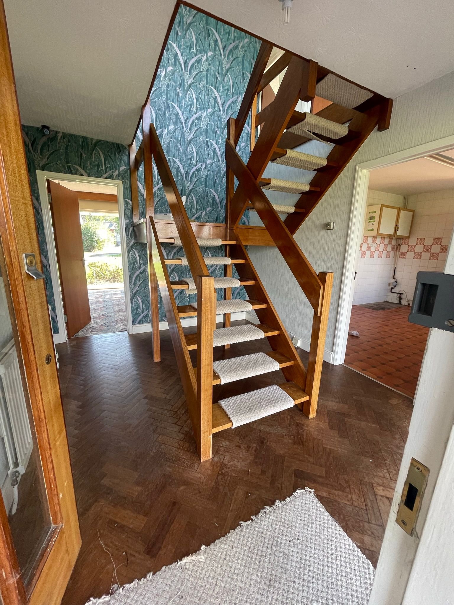 Before: stairs and wallpaper from my nightmares.