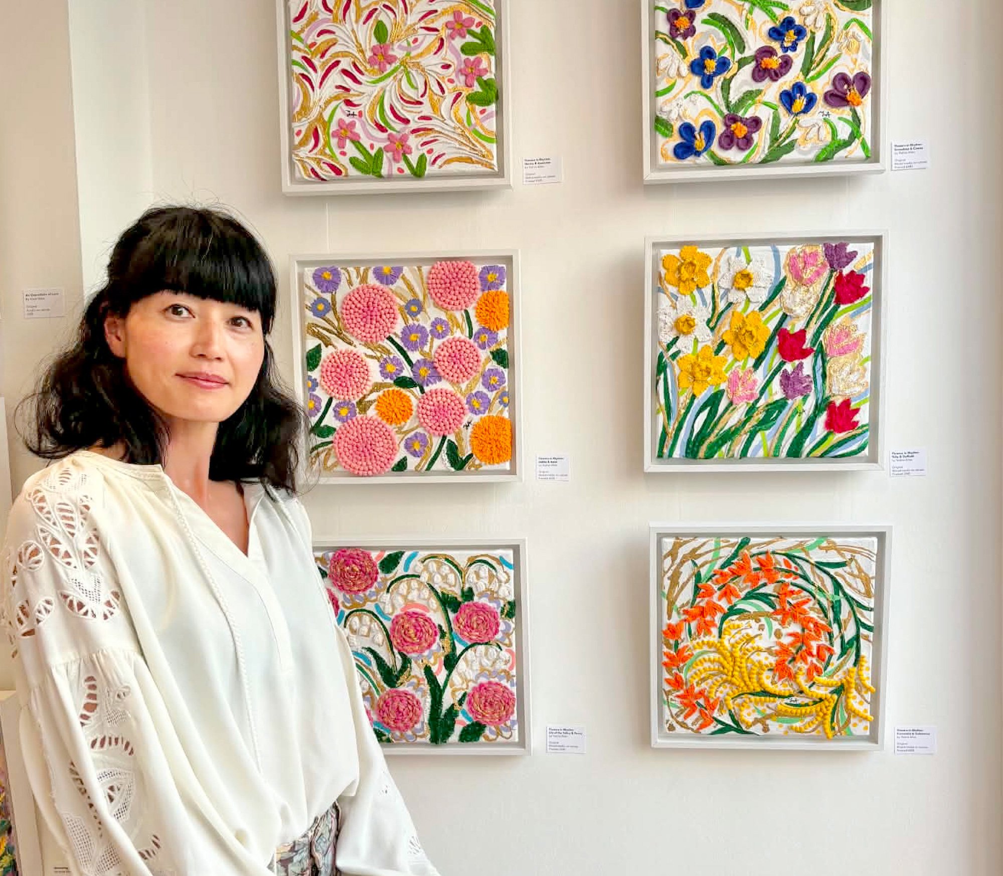 UK based visual artist Yoshie Allan, with her mixed media floral artwork at group exhibition - Floral Stories, an exhibition by JoyBeam Art Collective, held at 67 York Street Gallery, Marylebone, London, 2026.