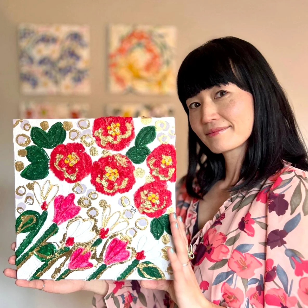 visual artist yoshie allan with her mixed media flower artwork.