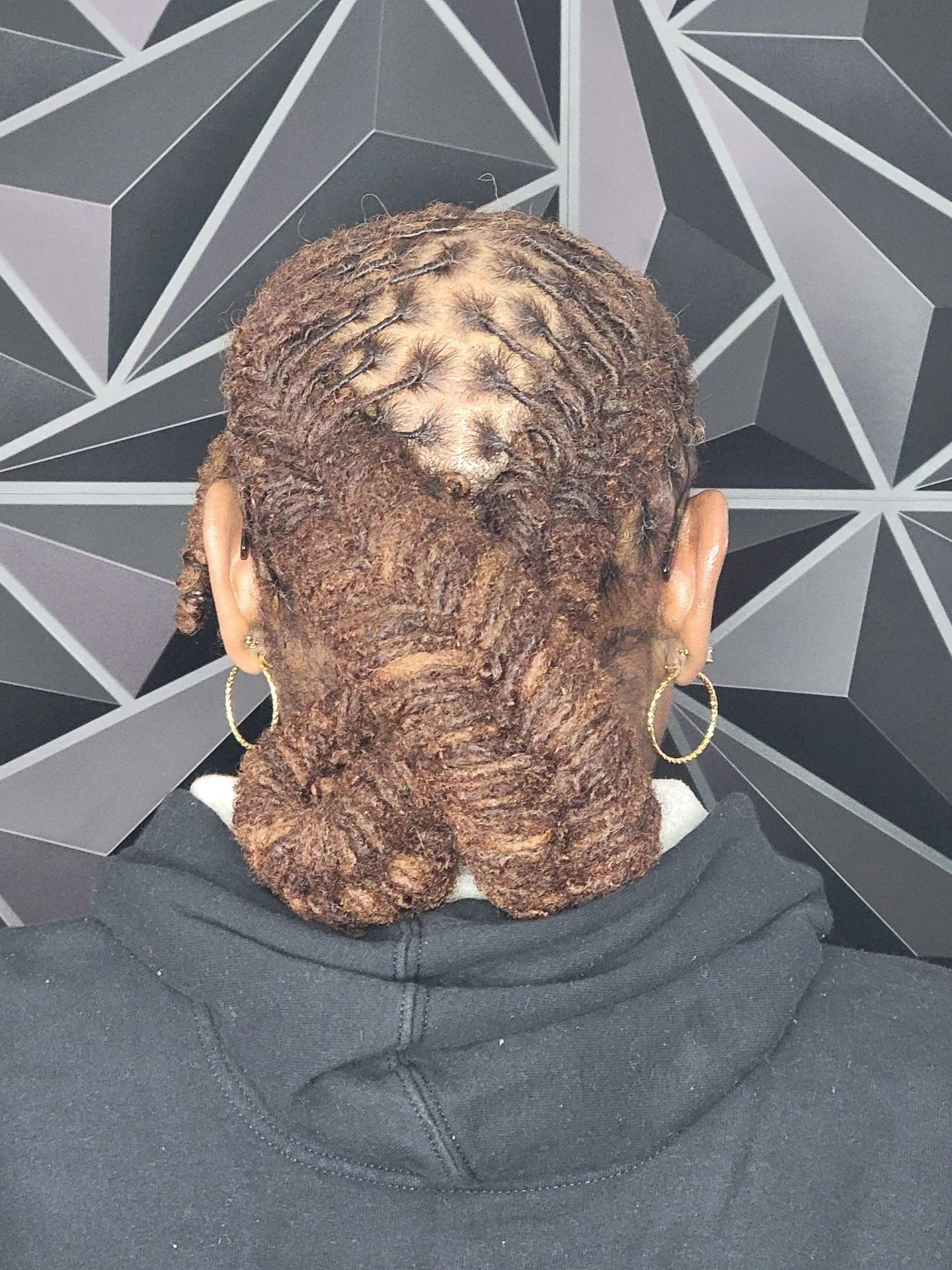 This Queen is rocking two fishbone braids in her locks with  beautiful bun.