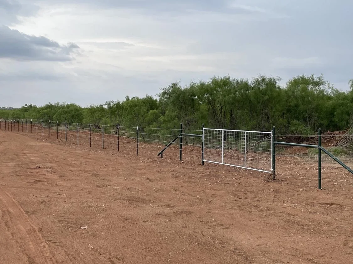 Barbed wire fence with gate