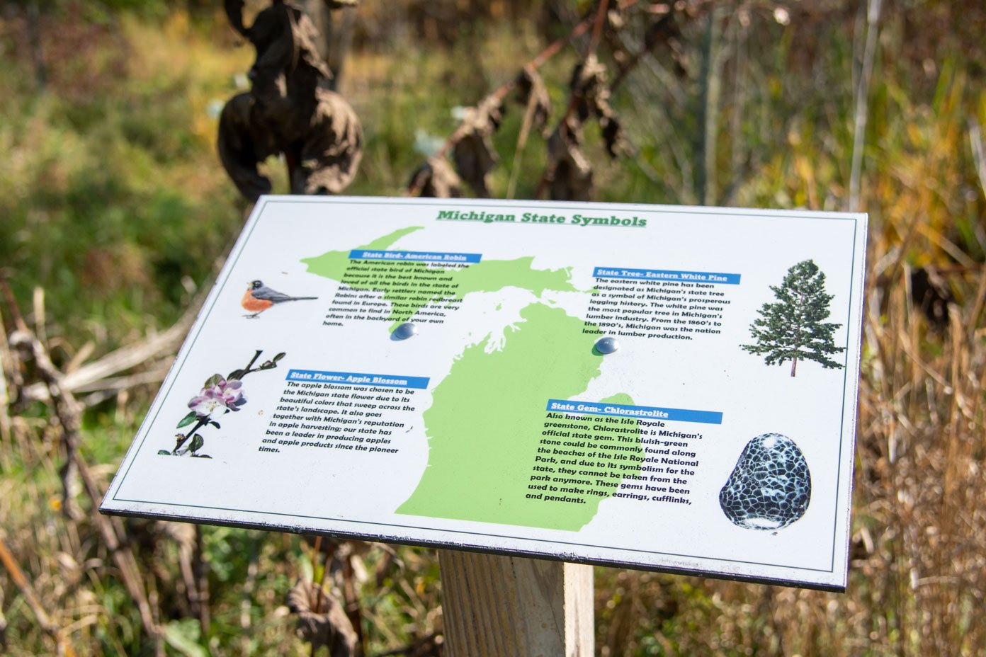 Outdoor signage showcasing Michigan symbols
