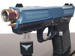 A blue toy or replica handgun with a metallic barrel and a black handle, displayed on a stand with a logo.