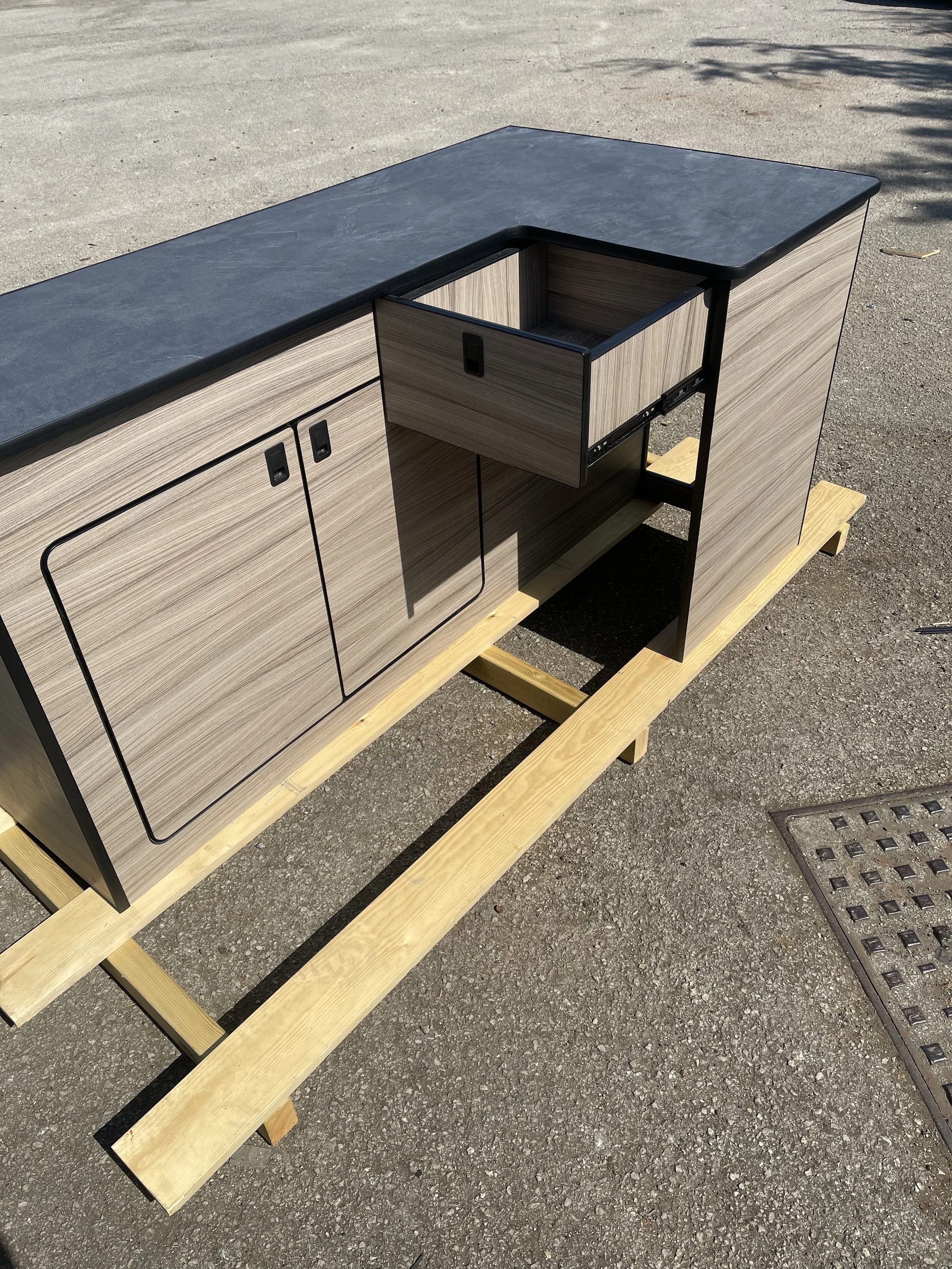 Camper pod in  wood effect with slate grey worktop 