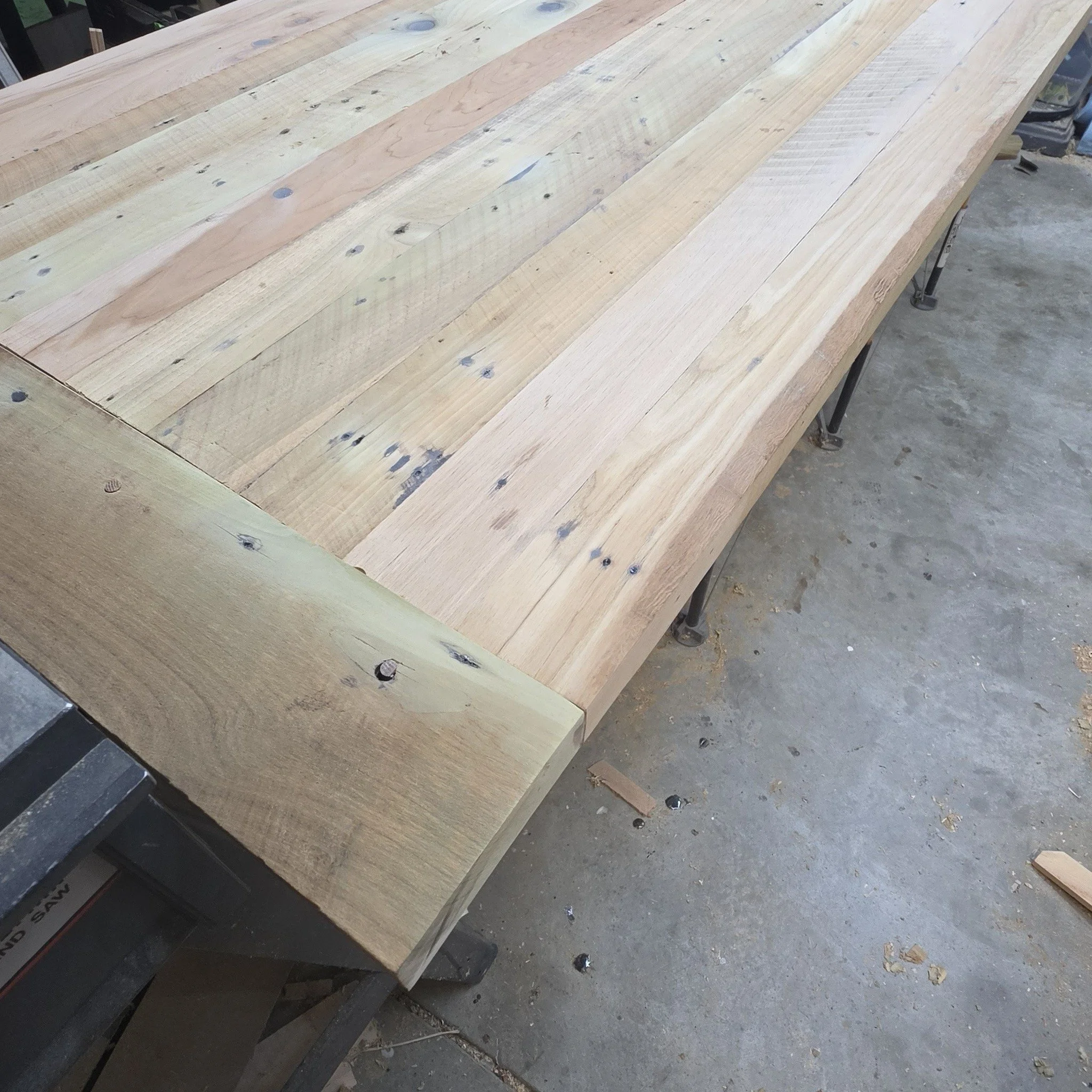 A work in progress.  I've been busy building an heirloom dining room table for a good friend of mine.  This is made from (nearly) 100 year old lumber taken from their house during a recent remodel.  We're keeping it very rustic.  This type of table i
