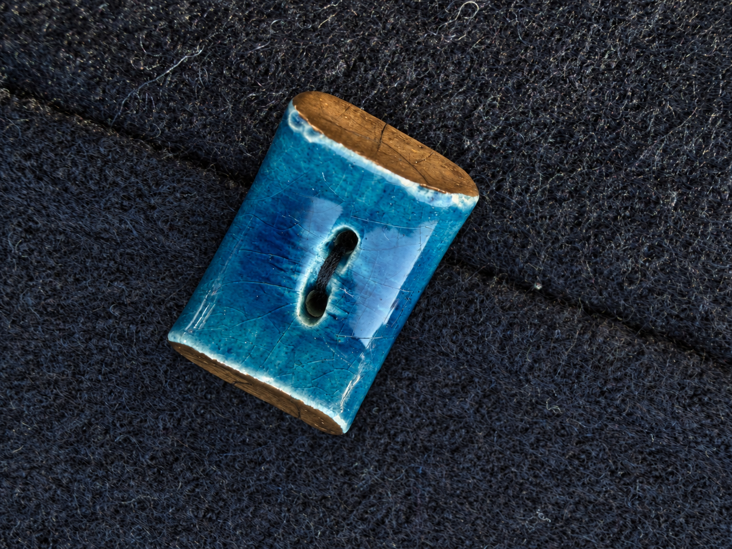 Crackled Turquoise Ceramic Button on Wool.png
