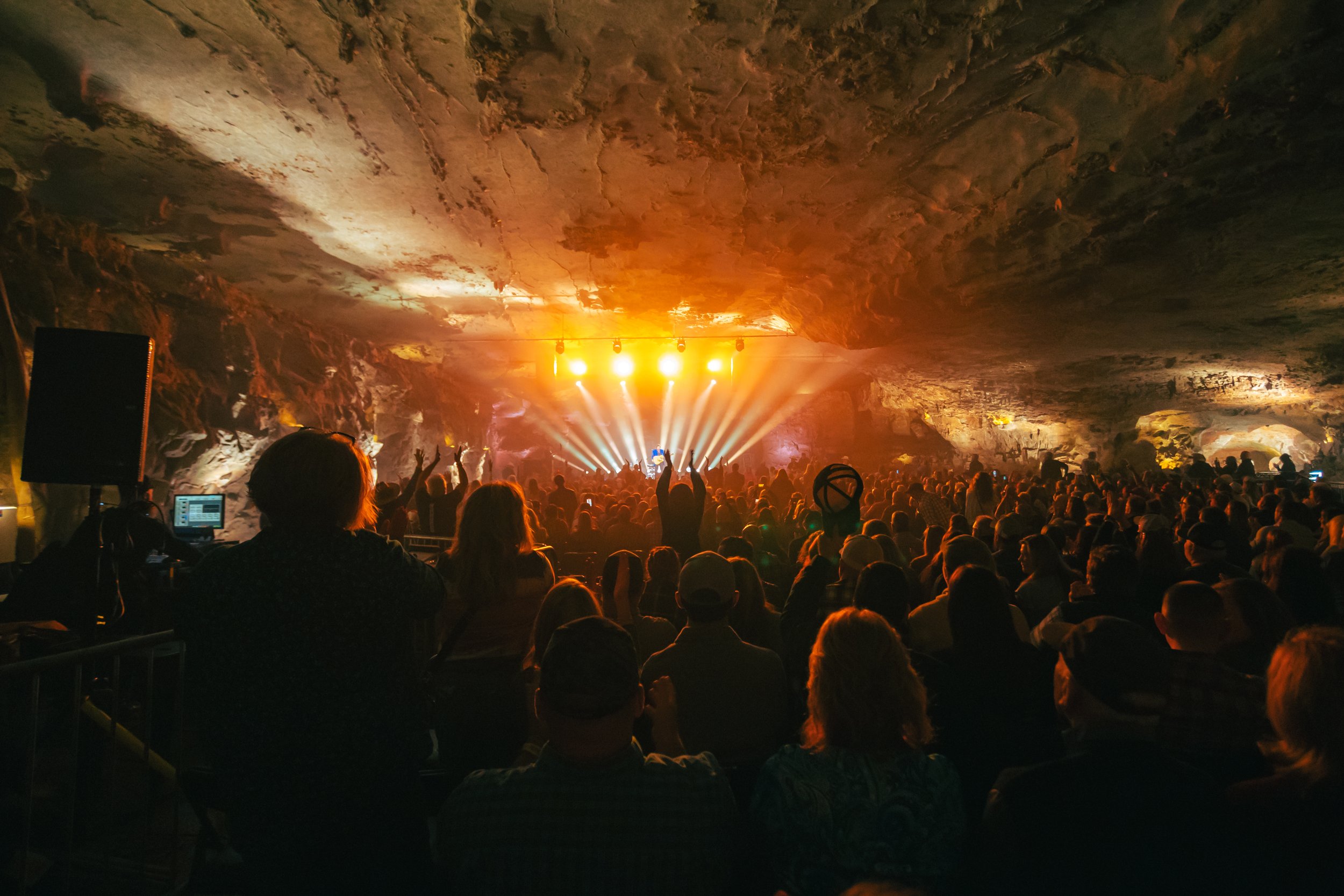 Crowd of people attending a concert in The Caverns in Pelham, TN.