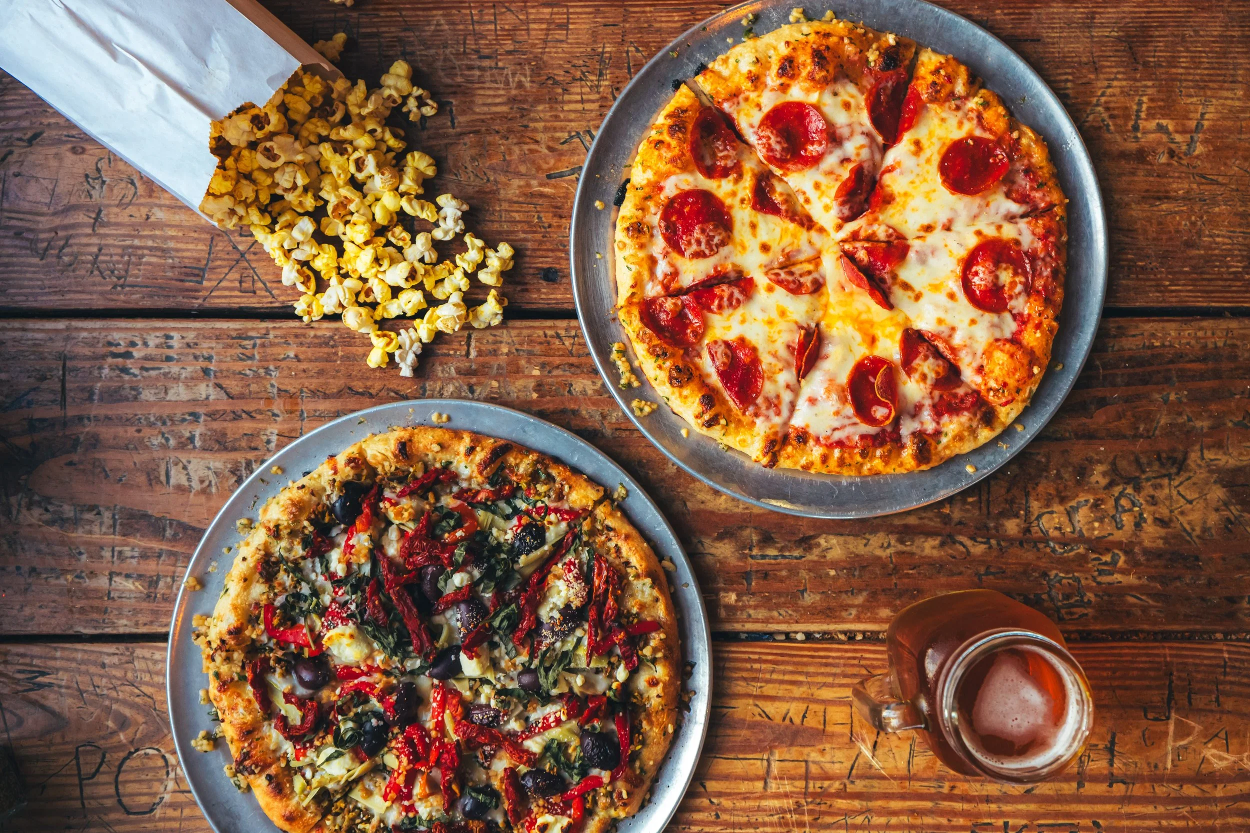 Two pizzas on metal trays,at Shenanigans in Sewanee, TN.