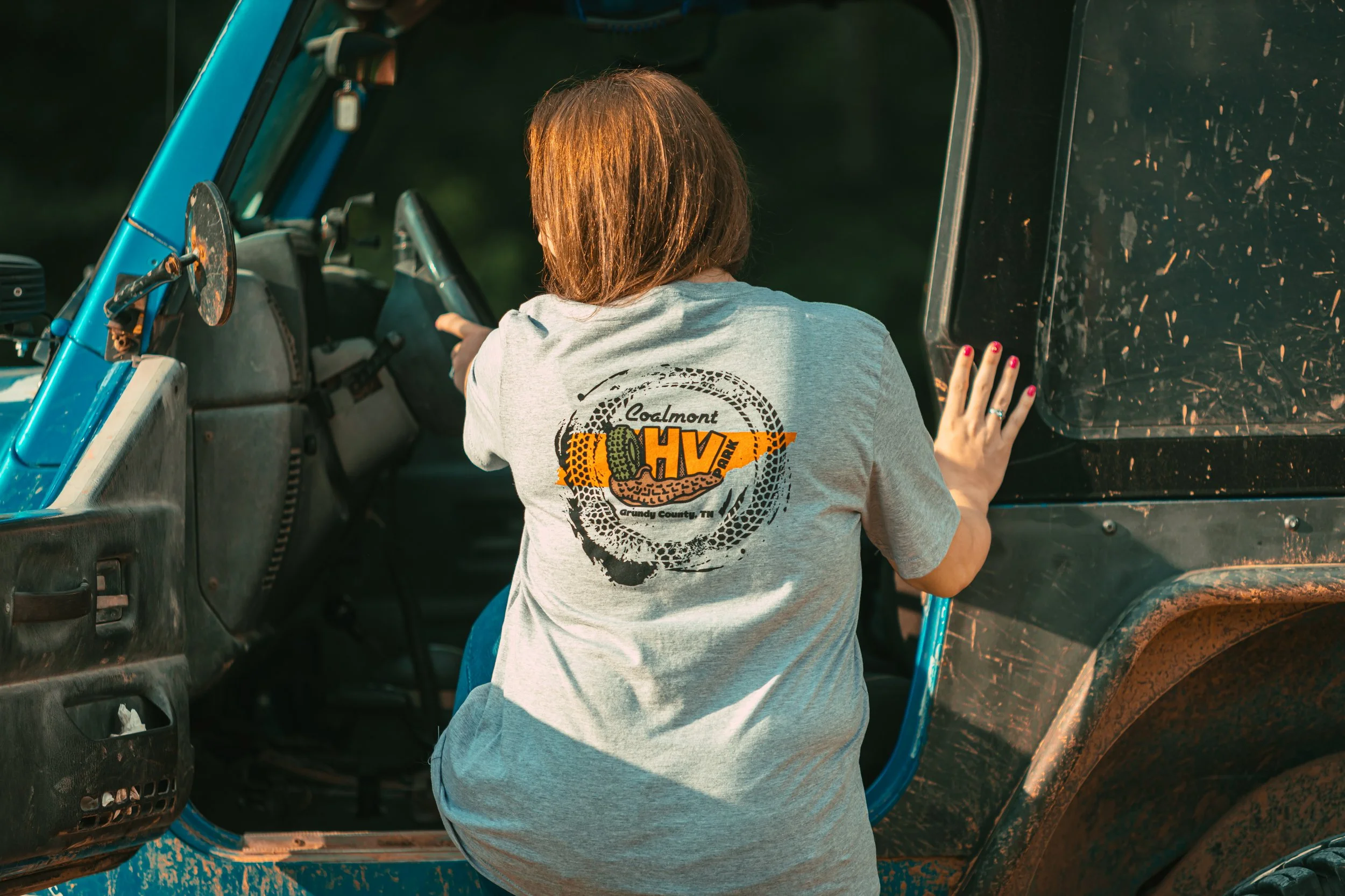 woman modeling a Coalmont OHV Park T-shirt.