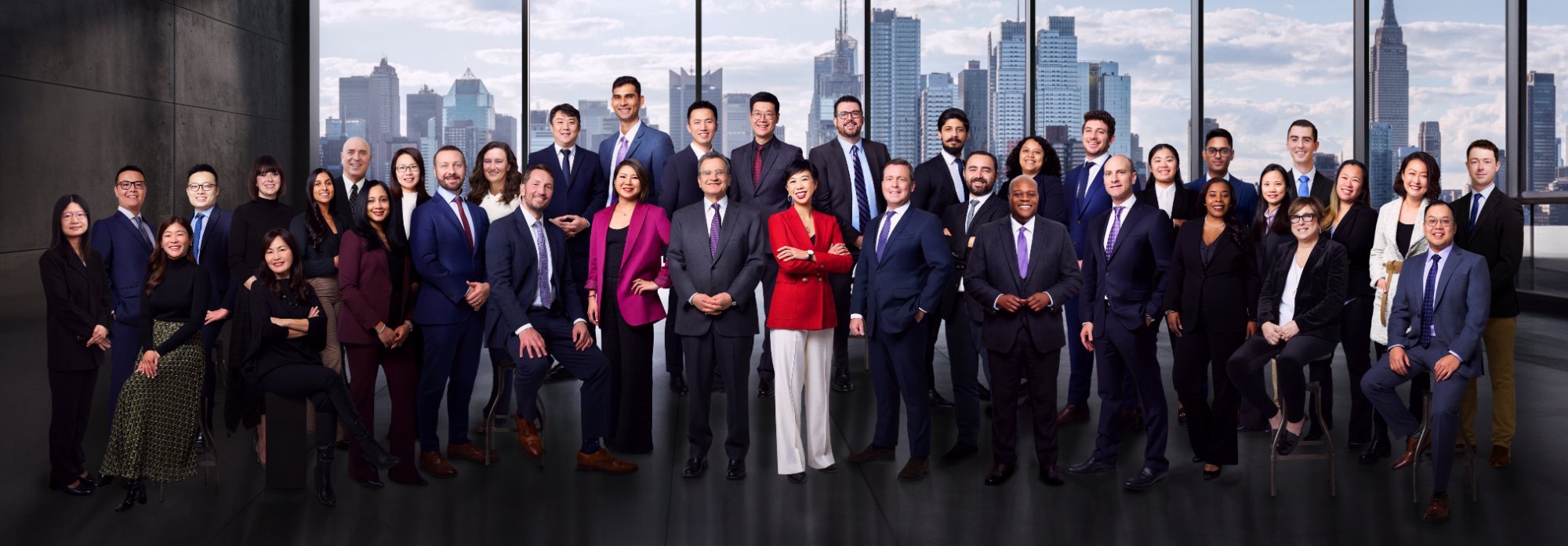 Corporate team headshots NYC: group portrait of a company team in a Manhattan skyline office by Turi Productions