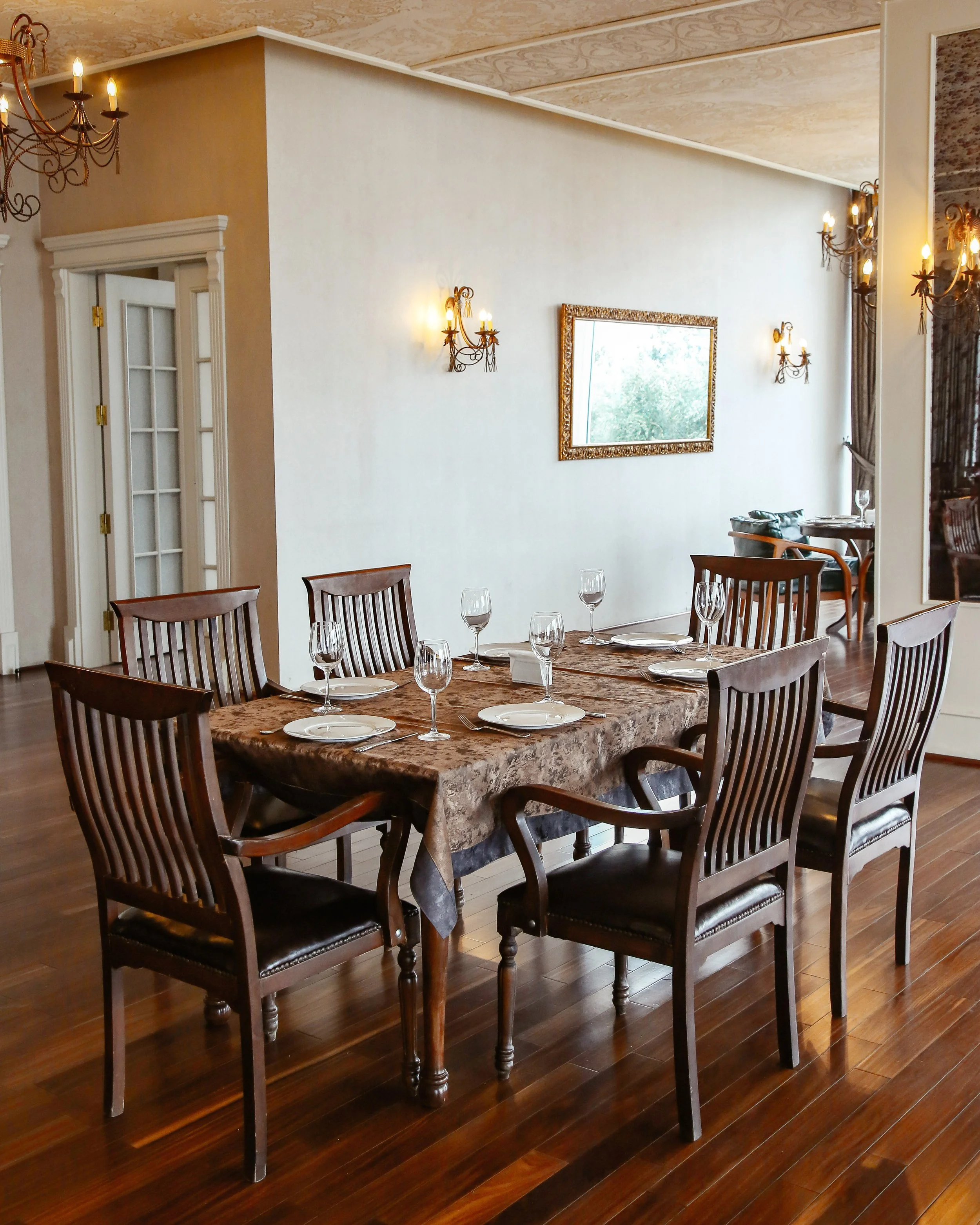 restaurant-table-with-wooden-chairs-placed-hall-decorated-classical-style.jpg