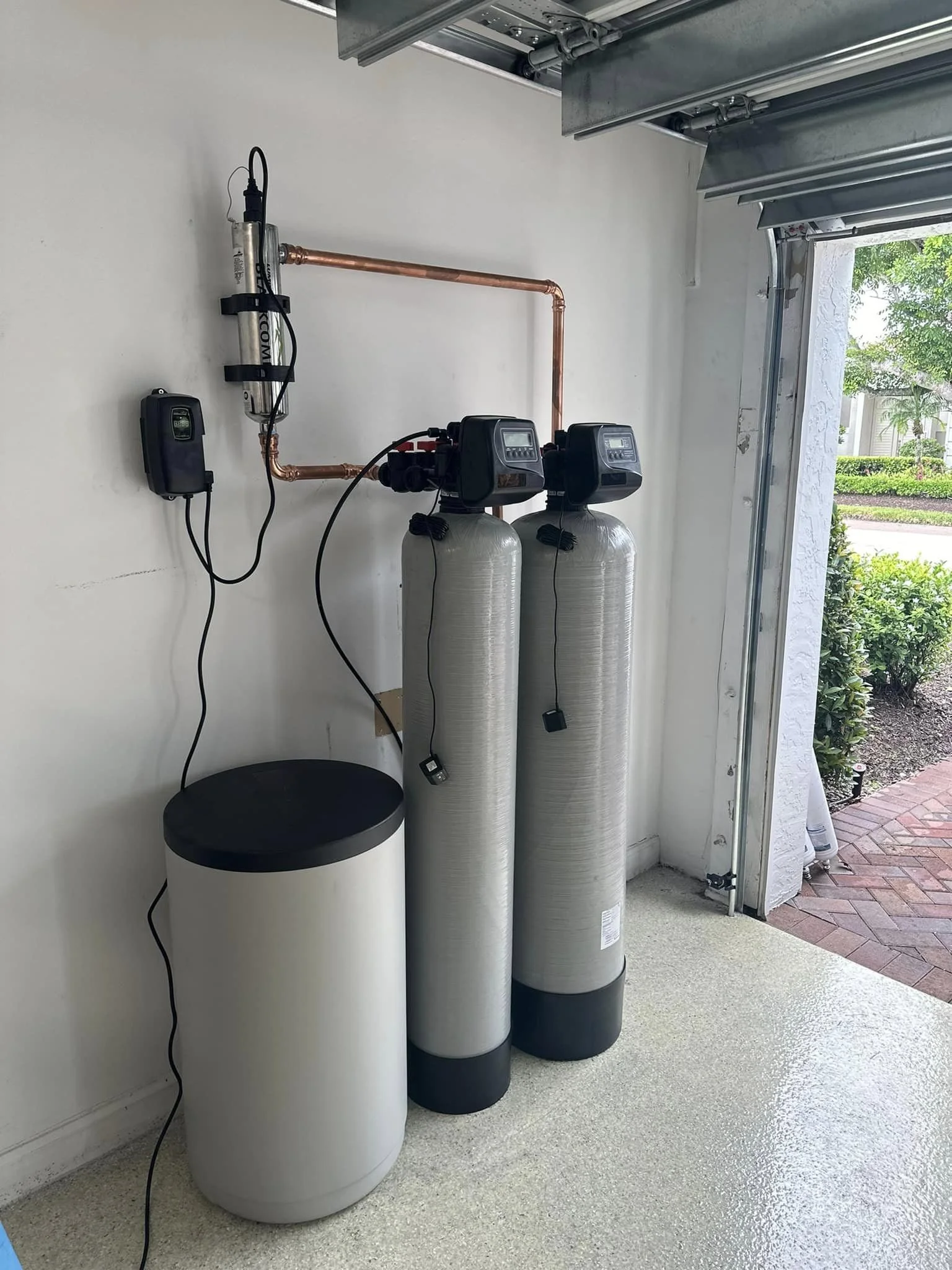 Whole house water filter and softener installation.