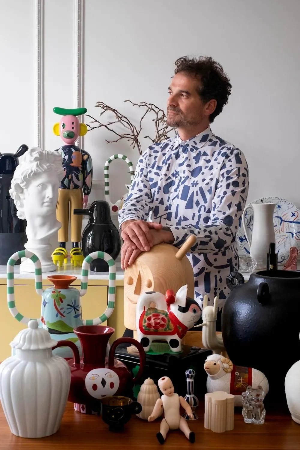 Designer Jaime Hayon among his various design objects Joseph Fox
