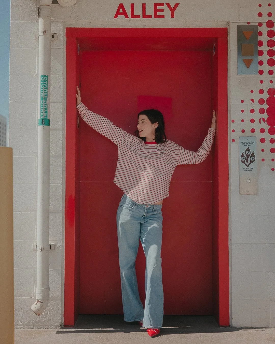 A Santa Monica rooftop, a red door, and @shaelanders in motion.