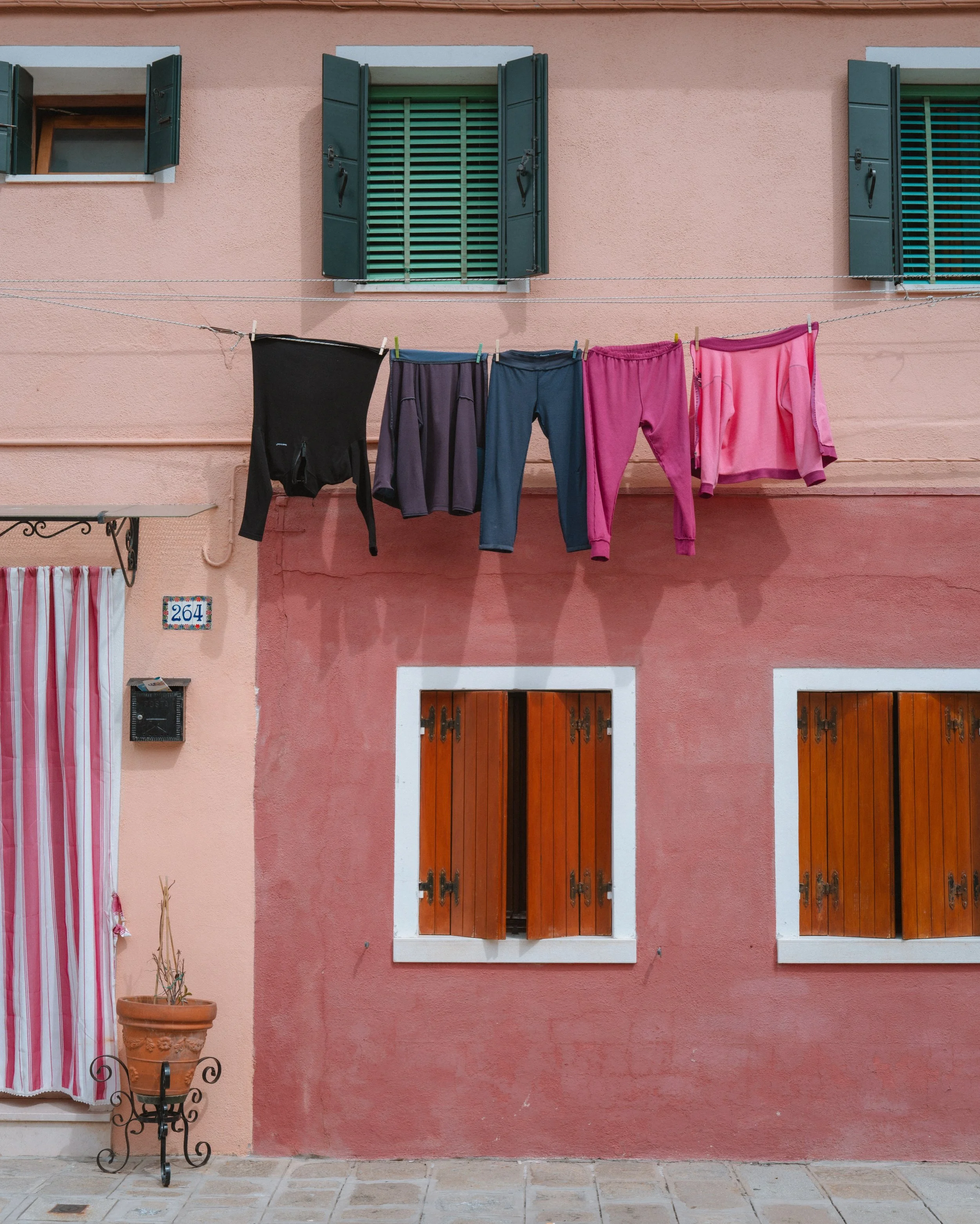 Burano, Italy. April 2026. 🇮🇹

An island known for its brightly painted homes, but it was the everyday moments among all that color that caught my eye. Laundry out to dry, flowers carried home, boots by the door, and little glimpses of daily life.