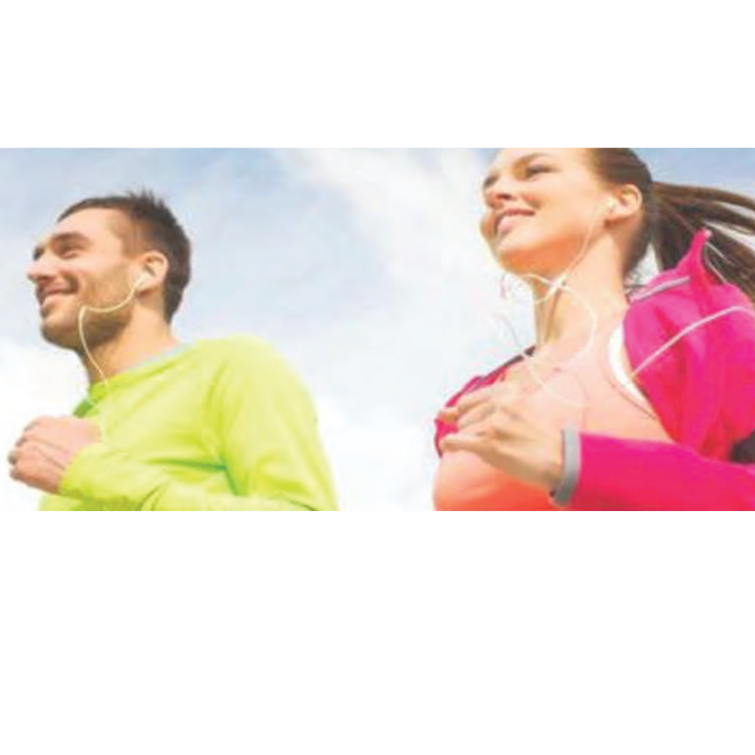 Two people, a man and a woman, jogging outdoors in colorful athletic clothing while wearing earphones, smiling and enjoying their exercise.