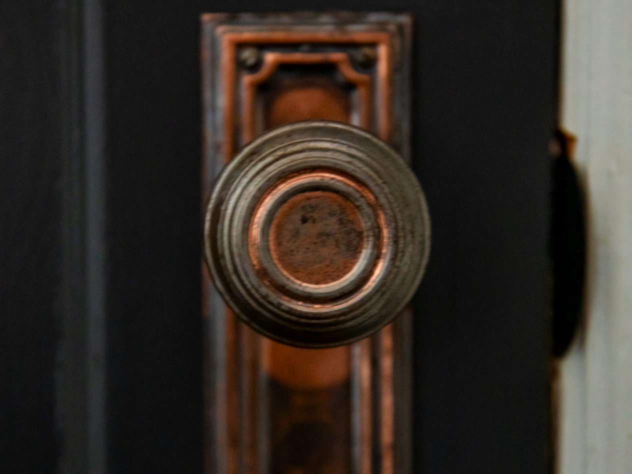 I Stripped Decades of Paint Off My 1930s Front Door — and Found Something Better Underneath