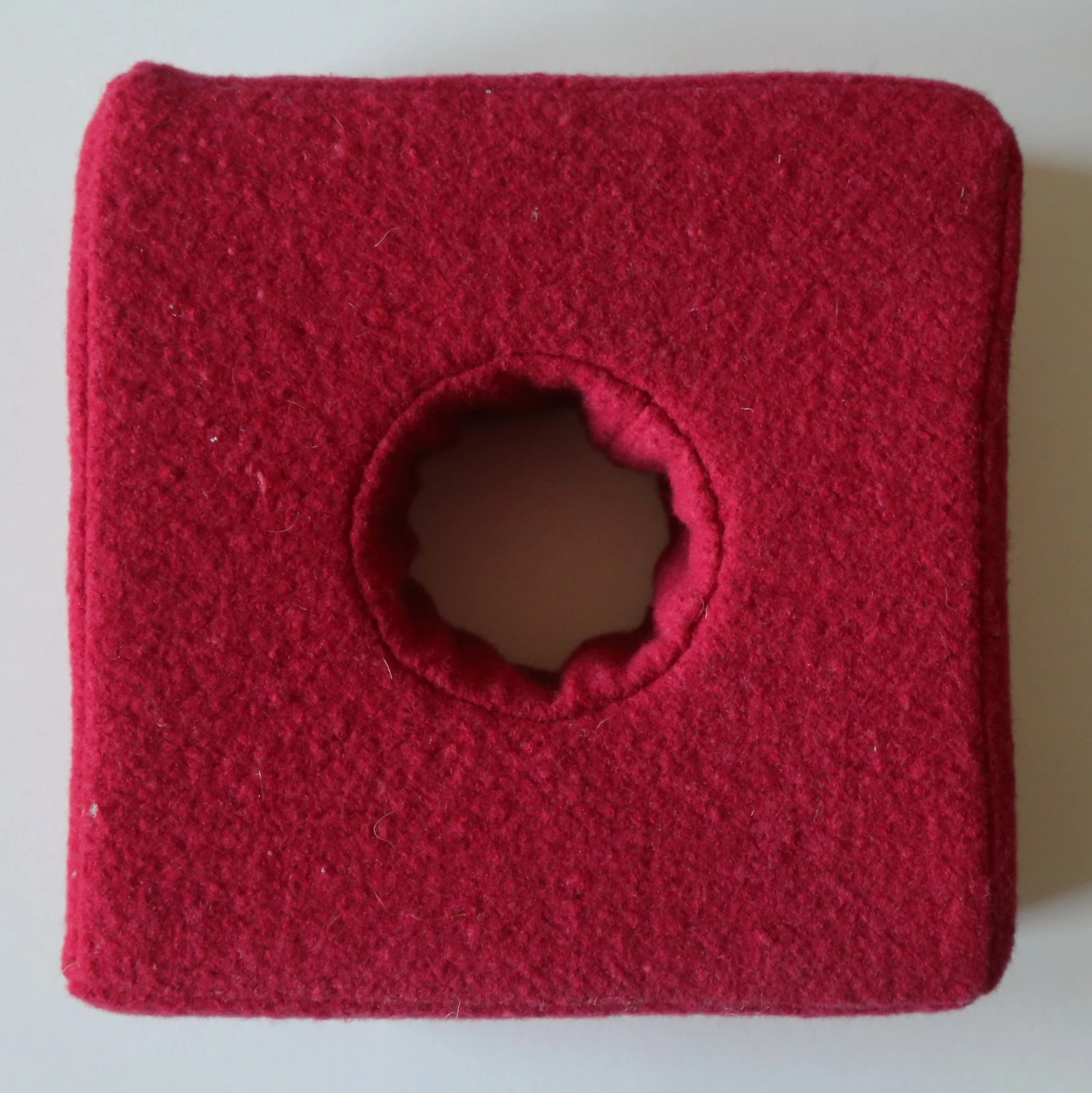 wool blanket, foam felting block. 23 x 23 x 8cm
