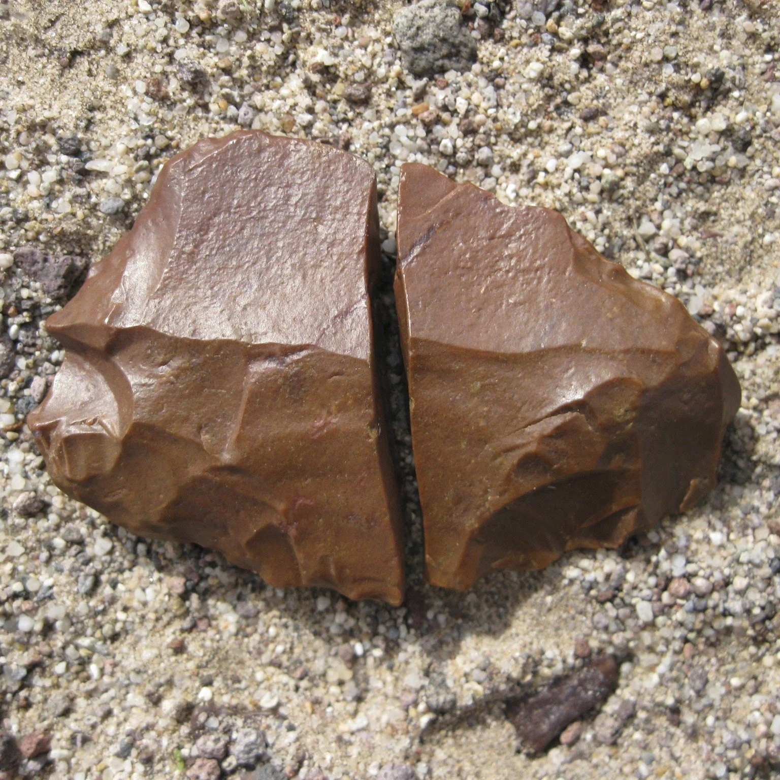 Leave No Stone Unturned! 
An awesome find from a past cultural resources survey! This piece of jasper was clearly being worked. The photos show details of lithic reduction (stone tool making). Notice the flaking on one side and cortex (nearly untouch