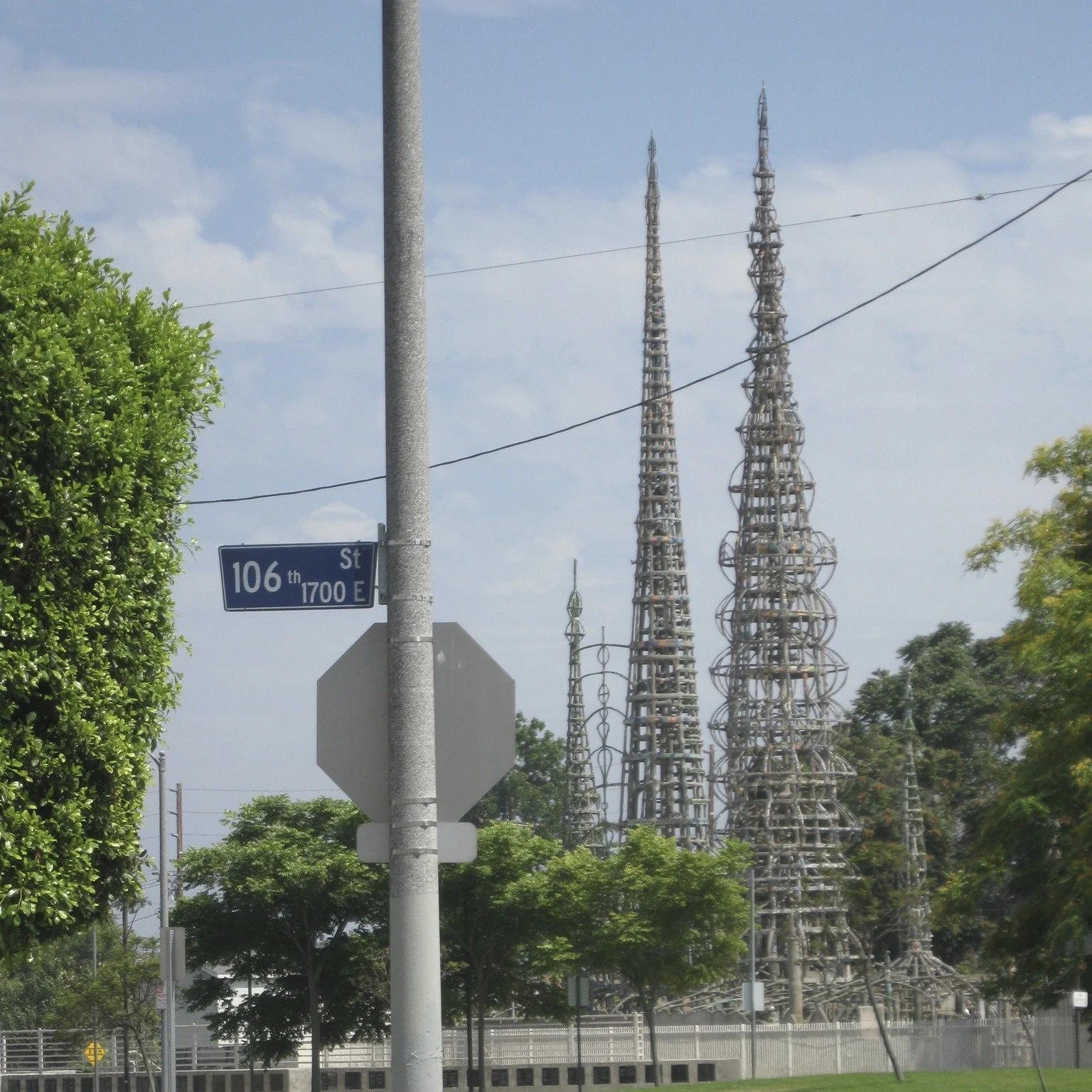 A Labor of Love and Steel
Standing at the corner of 107th St, these seventeen interconnected sculptural towers are a marvel of structural engineering and individual willpower. They were created by an Italian immigrant named Simon Rodia, who worked on
