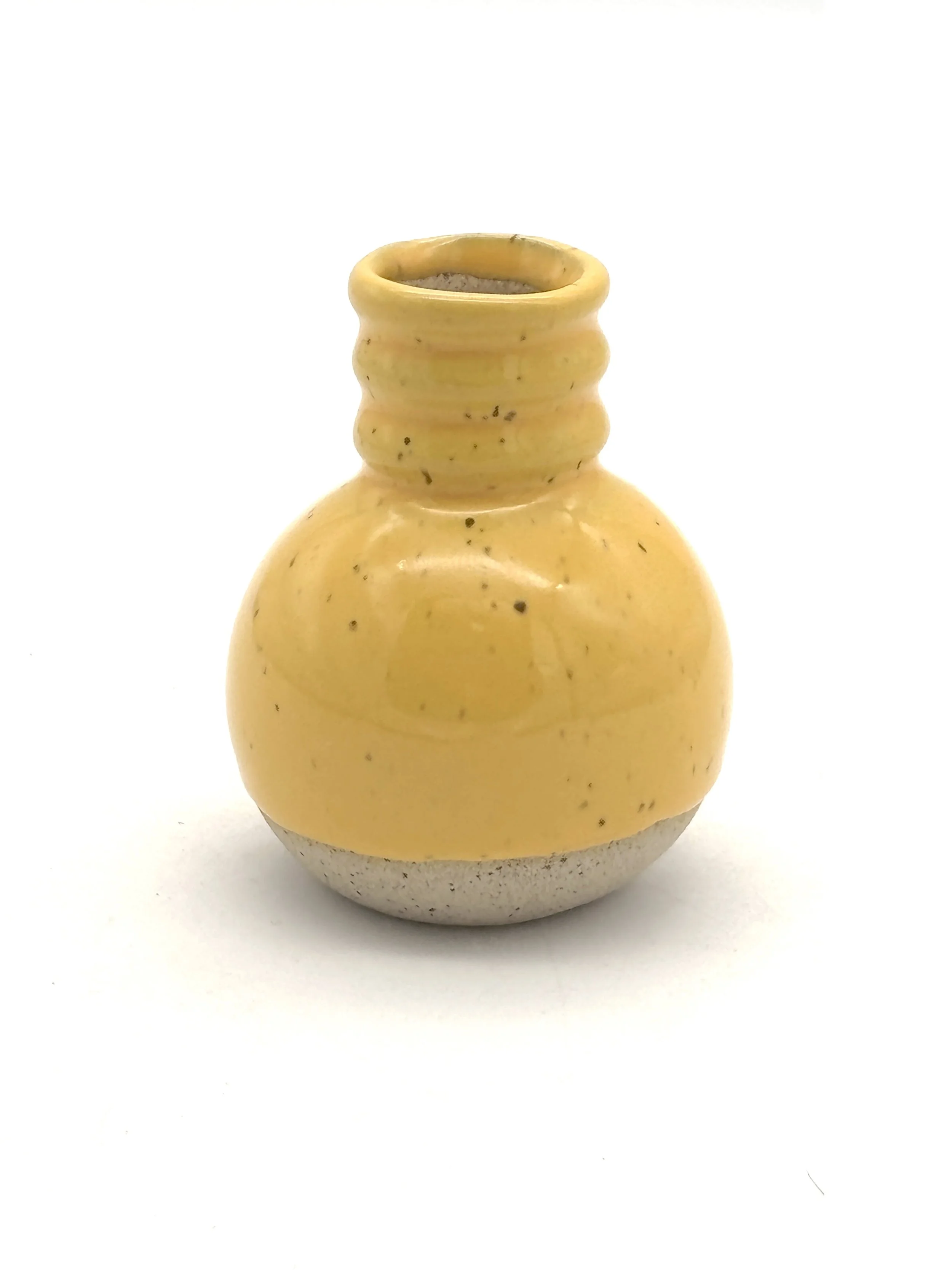 Yellow ceramic vase with a wide body, narrow neck, and three ridges near the top, set against a white background.