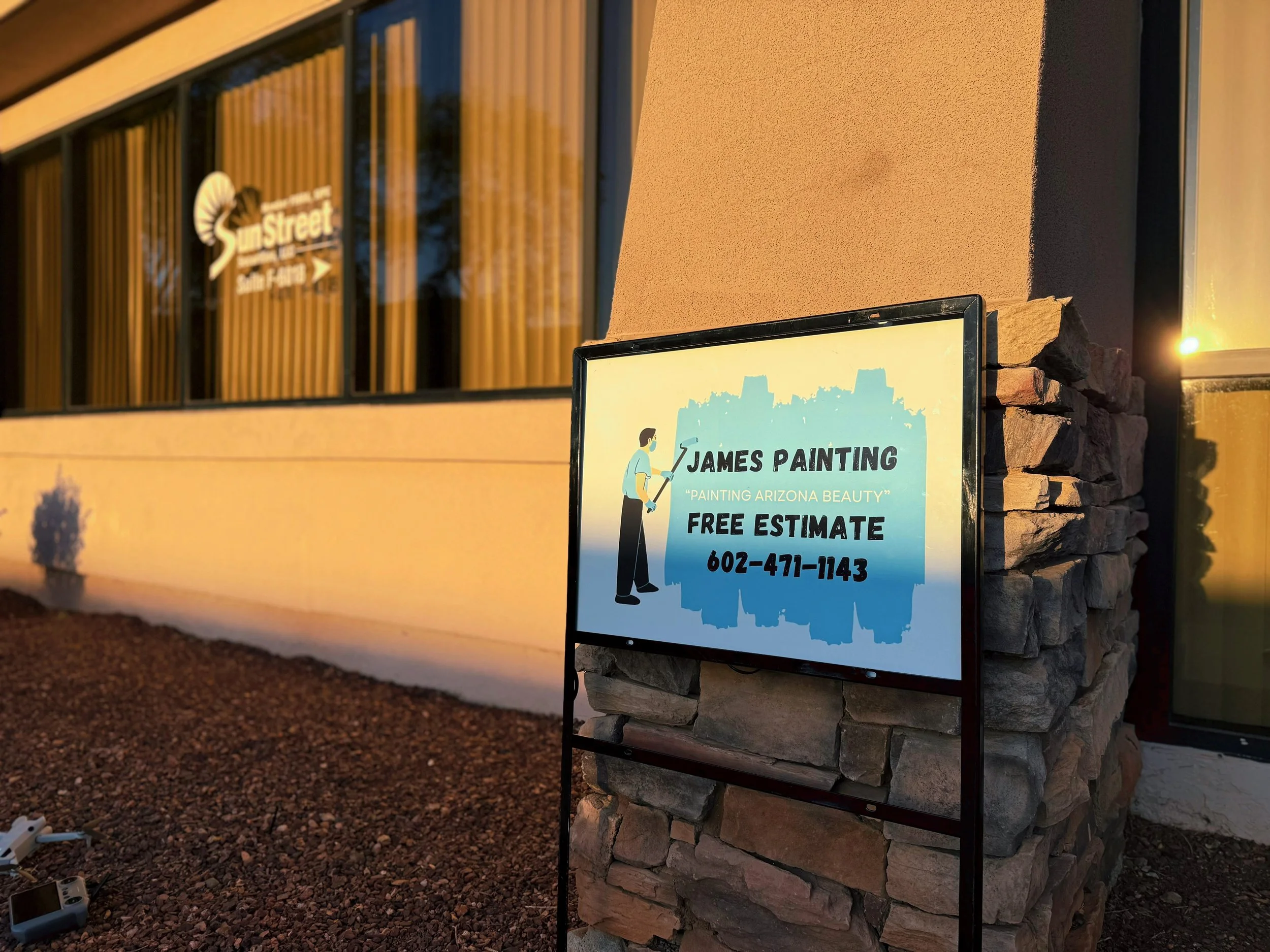 James Painting Sign at Office.JPG